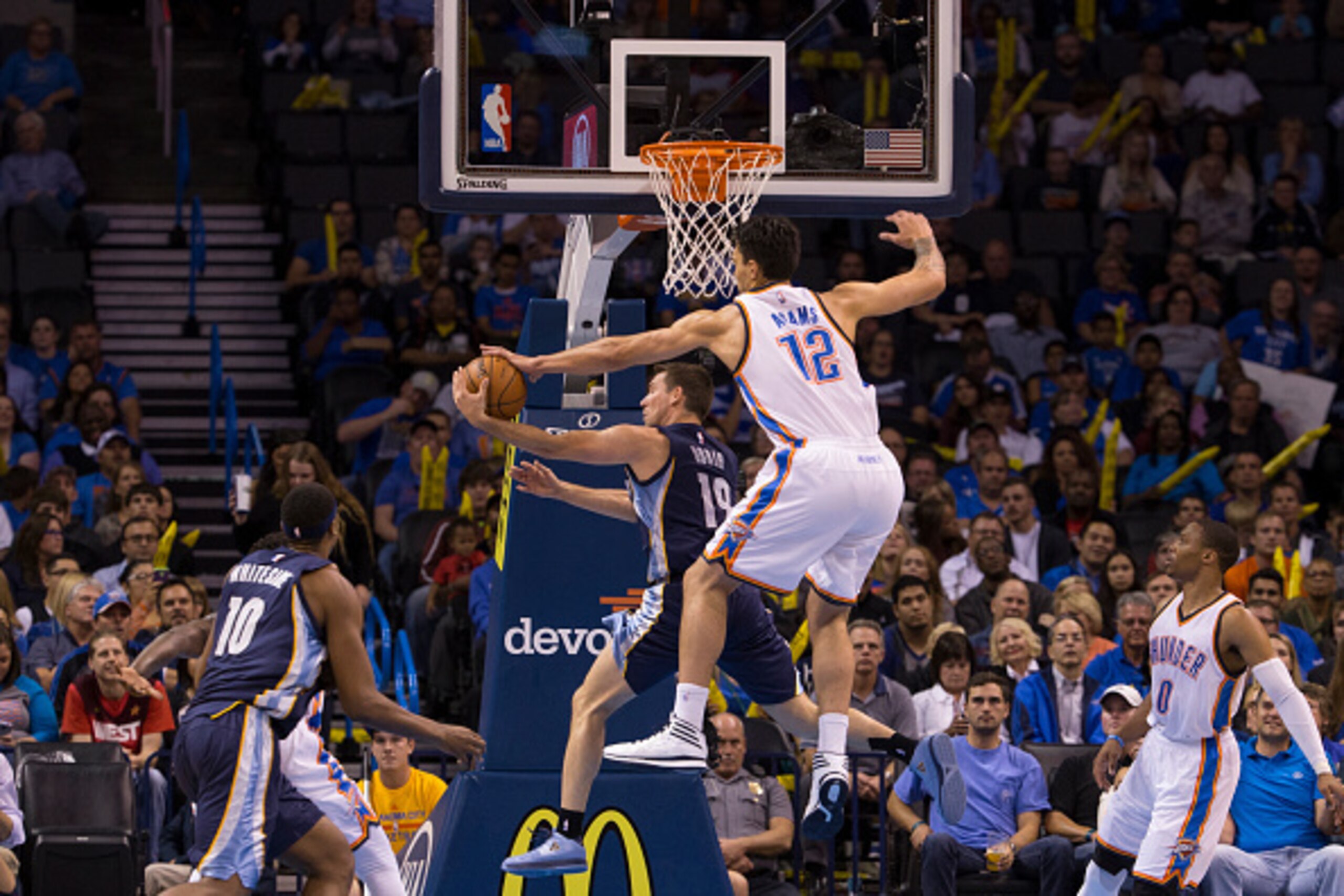 OKLAHOMA CITY, OK - OCTOBER 14: Steven Adams #12 of the Oklahoma City Thunder blocks a shot against Beno Udrih #19 of the Memphis Grizzlies at the Chesapeak Energy Arena on October 14, 2014 in Oklahoma City, Oklahoma. NOTE TO USER: User expressly acknow OKLAHOMA CITY, OK - OCTOBER 14: Steven Adams #12 of the Oklahoma City Thunder blocks a shot against Beno Udrih #19 of the Memphis Grizzlies at the Chesapeak Energy Arena on October 14, 2014 in Oklahoma City, Oklahoma. NOTE TO USER: User expressly acknow