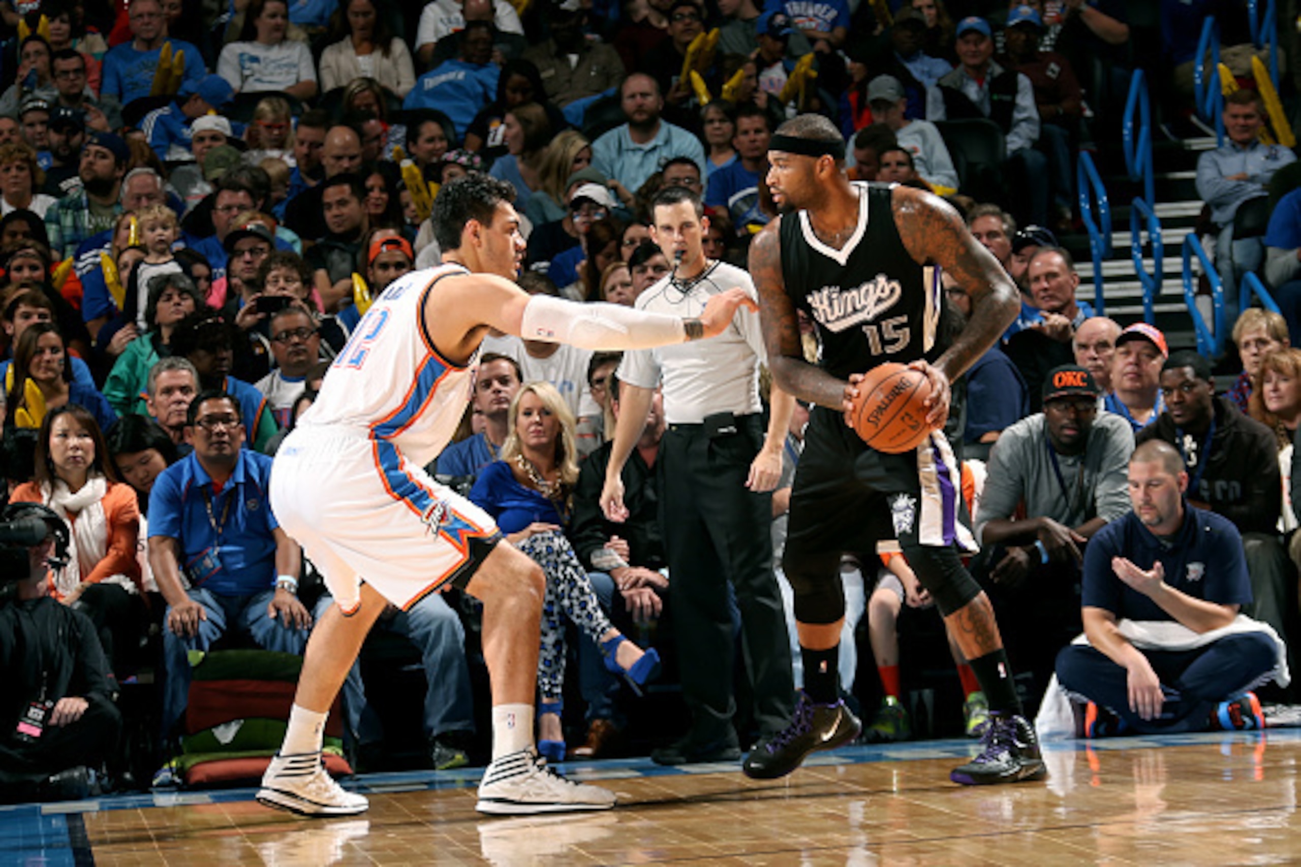 OKLAHOMA CITY, OK- NOVEMBER 9: DeMarcus Cousins #15 of the Sacramento Kings handles the ball against Steven Adams #12 of the Oklahoma City Thunder on November 9, 2014 at Chesapeake Energy Arena in Oklahoma City, OK. NOTE TO USER: User expressly acknowled OKLAHOMA CITY, OK- NOVEMBER 9: DeMarcus Cousins #15 of the Sacramento Kings handles the ball against Steven Adams #12 of the Oklahoma City Thunder on November 9, 2014 at Chesapeake Energy Arena in Oklahoma City, OK. NOTE TO USER: User expressly acknowled