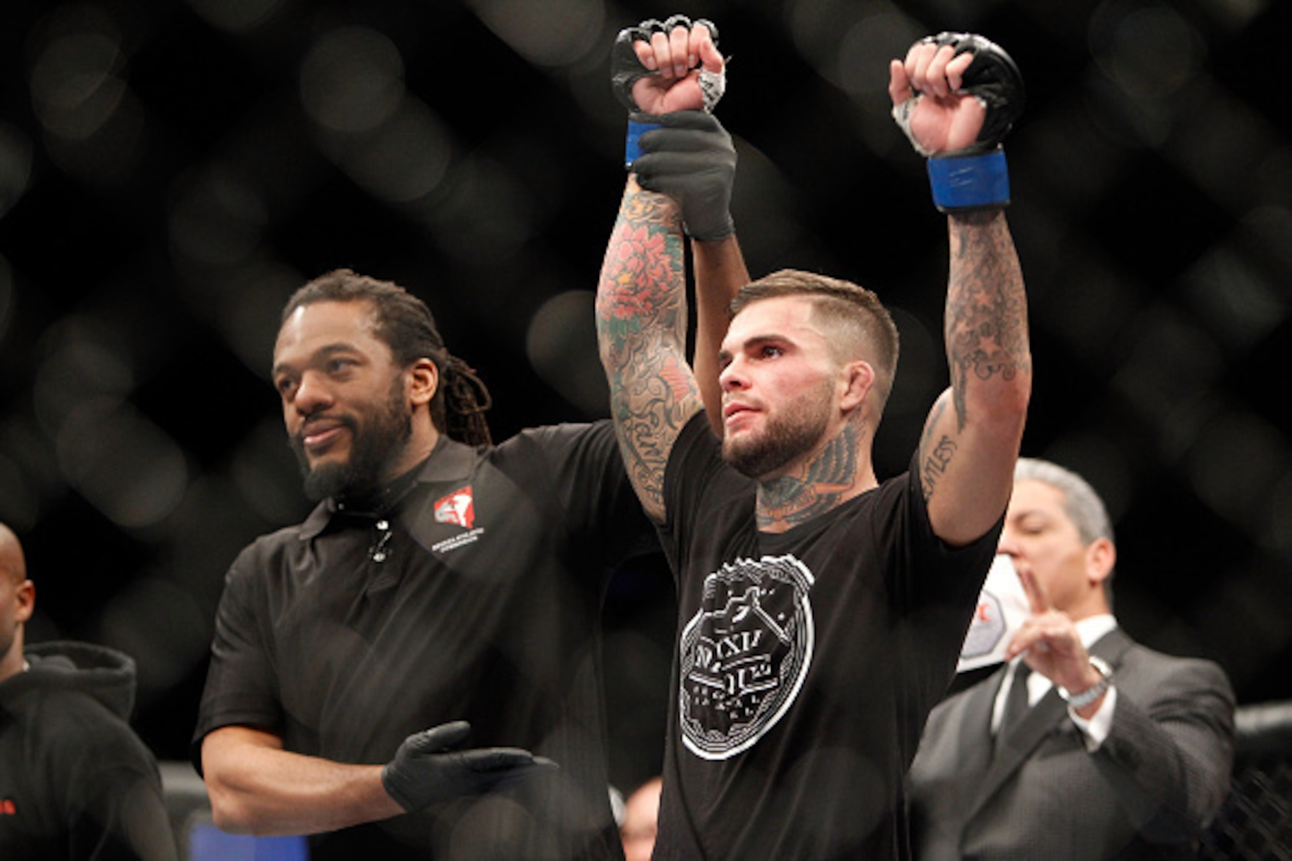LAS VEGAS, NV - JANUARY 03:  Bantamweight fighter Cody Garbrandt (R) celebrates his victory over Marcus Brimage at the MGM Grand Garden Arena on January 3, 2015 in Las Vegas, Nevada. Garbrandt won by TKO in the third round.  (Photo by Steve Marcus/Getty I