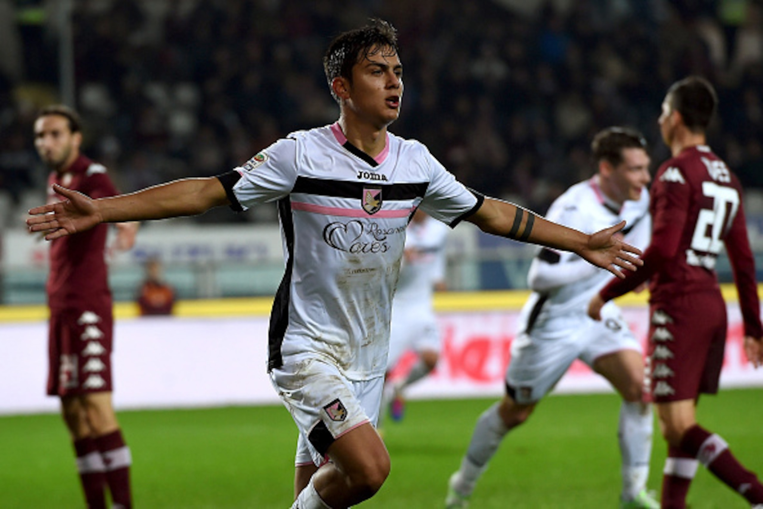TURIN, ITALY - DECEMBER 06:  Paulo Dybala of Palermo celebrates after scoring his team's second goal during the Serie A match between Torino FC and US Citta di Palermo at Stadio Olimpico di Torino on December 6, 2014 in Turin, Italy.  (Photo by Tullio M. 
