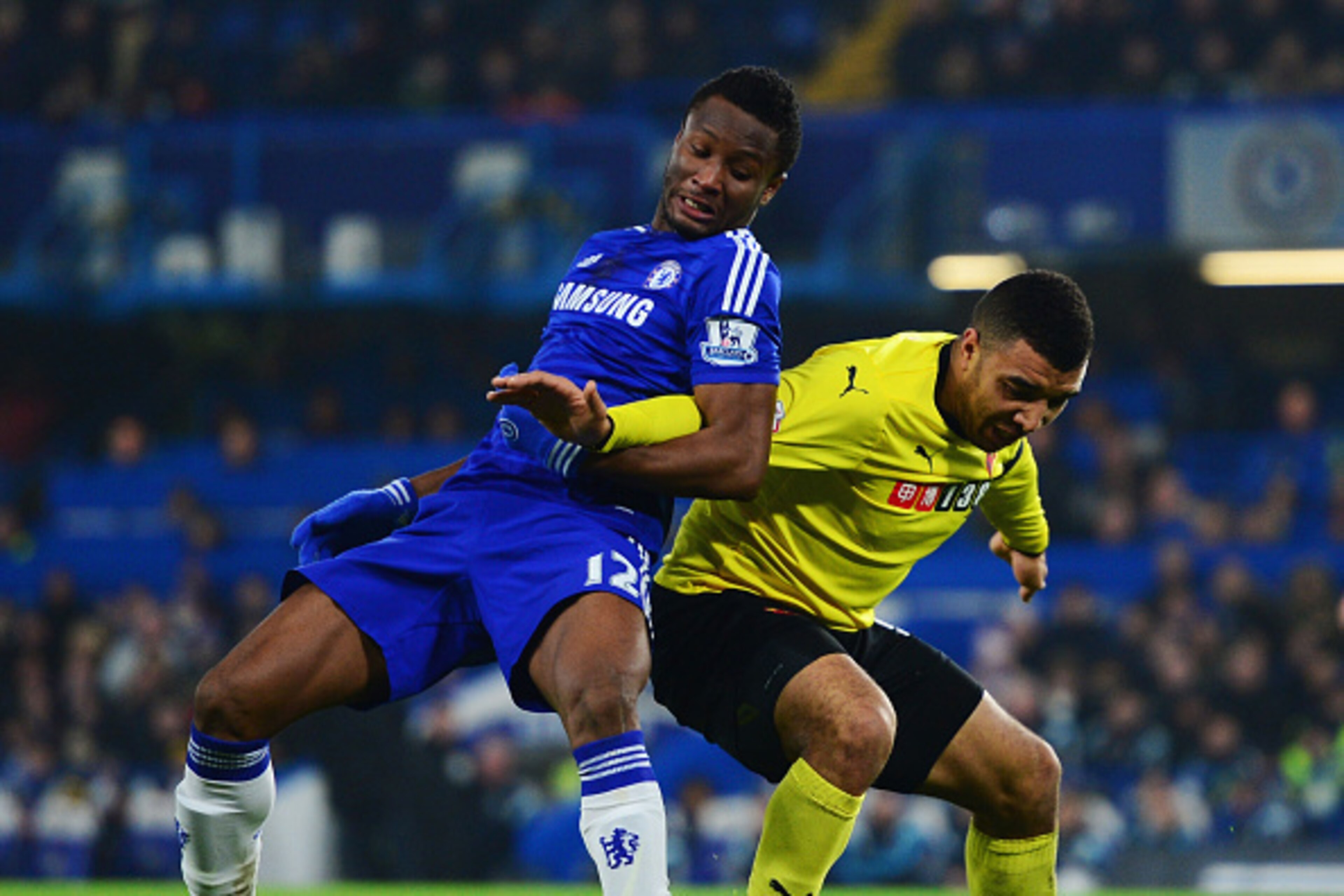 LONDON, ENGLAND - JANUARY 04:  John Obi Mikel of Chelsea battles with Troy Deeney of Watford  during the FA Cup Third Round match between Chelsea and Watford at Stamford Bridge on January 4, 2015 in London, England.  (Photo by Jamie McDonald/Getty Images)