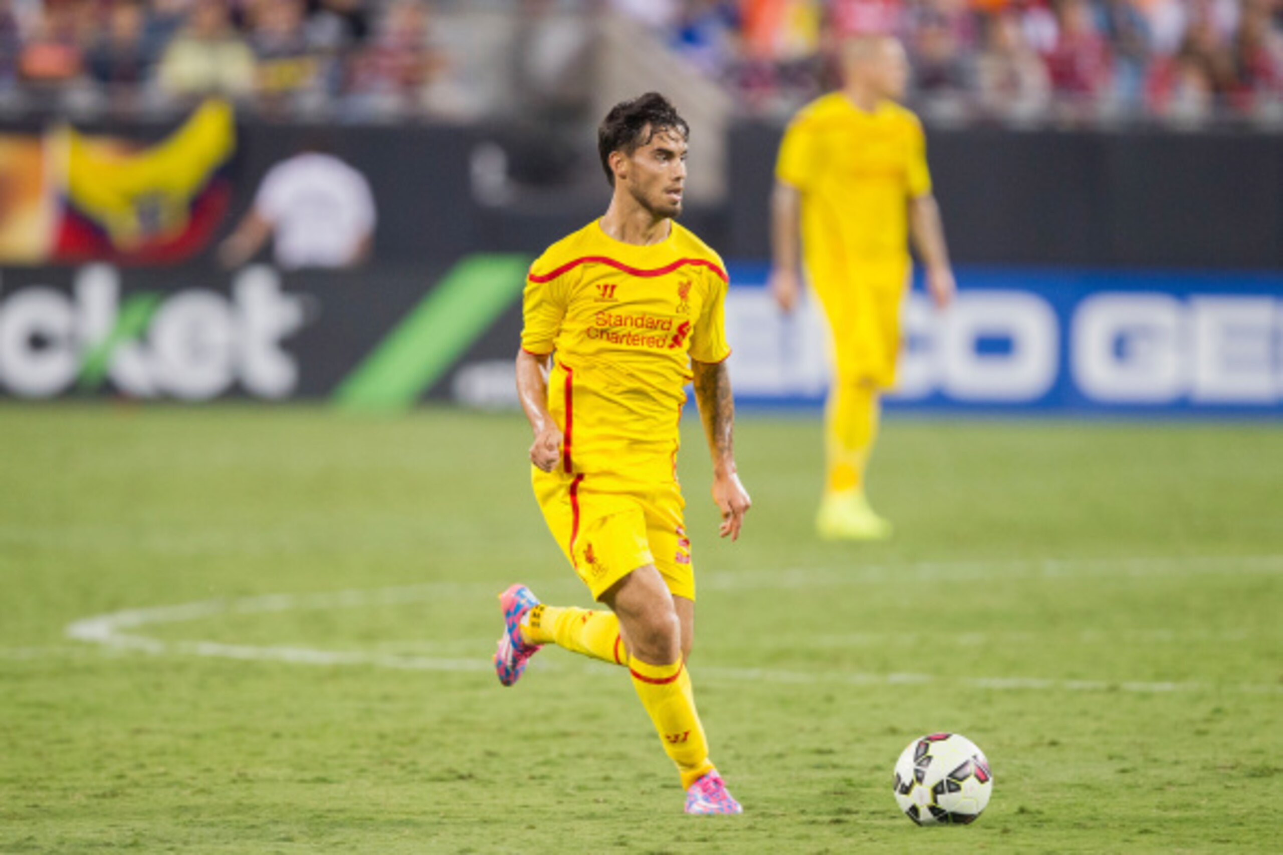 CHARLOTTE, NC - AUGUST 02: Suso #30 of Liverpool brings the ball up the field against A.C. Milan in the Guinness International Champions Cup at Bank of America Stadium on August 2, 2014 in Charlotte, North Carolina. Liverpool defeated A.C. Milan 2-0. (Pho CHARLOTTE, NC - AUGUST 02: Suso #30 of Liverpool brings the ball up the field against A.C. Milan in the Guinness International Champions Cup at Bank of America Stadium on August 2, 2014 in Charlotte, North Carolina. Liverpool defeated A.C. Milan 2-0. (Pho