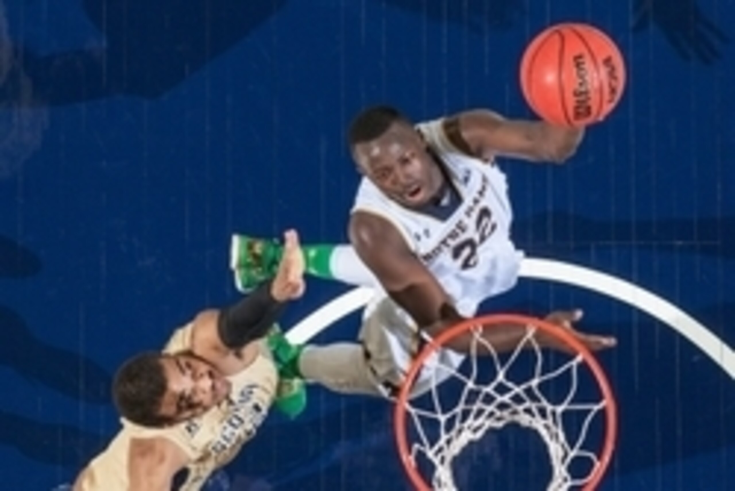 Jan 3, 2015; South Bend, IN, USA; Notre Dame Fighting Irish guard Jerian Grant (22) goes up for a shot as Georgia Tech Yellow Jackets forward Robert Sampson (13) defends in the second half at the Purcell Pavilion. Notre Dame won 83-76 in double overtime. 