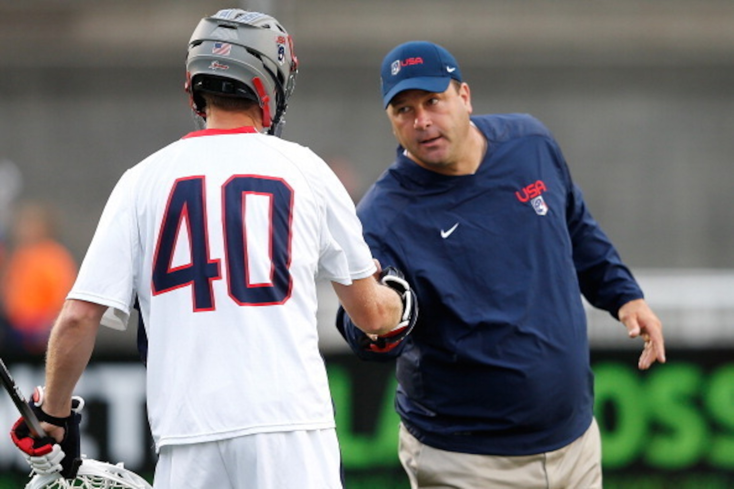 BOSTON, MA - JUNE 26: Dave Pietramala of Team USA interacts with a player before meeting Team MLL of the 2014 MLL All Star Game at Harvard Stadium on June 26, 2014 in Boston, Massachusetts.  (Photo by Jim Rogash/Getty Images)