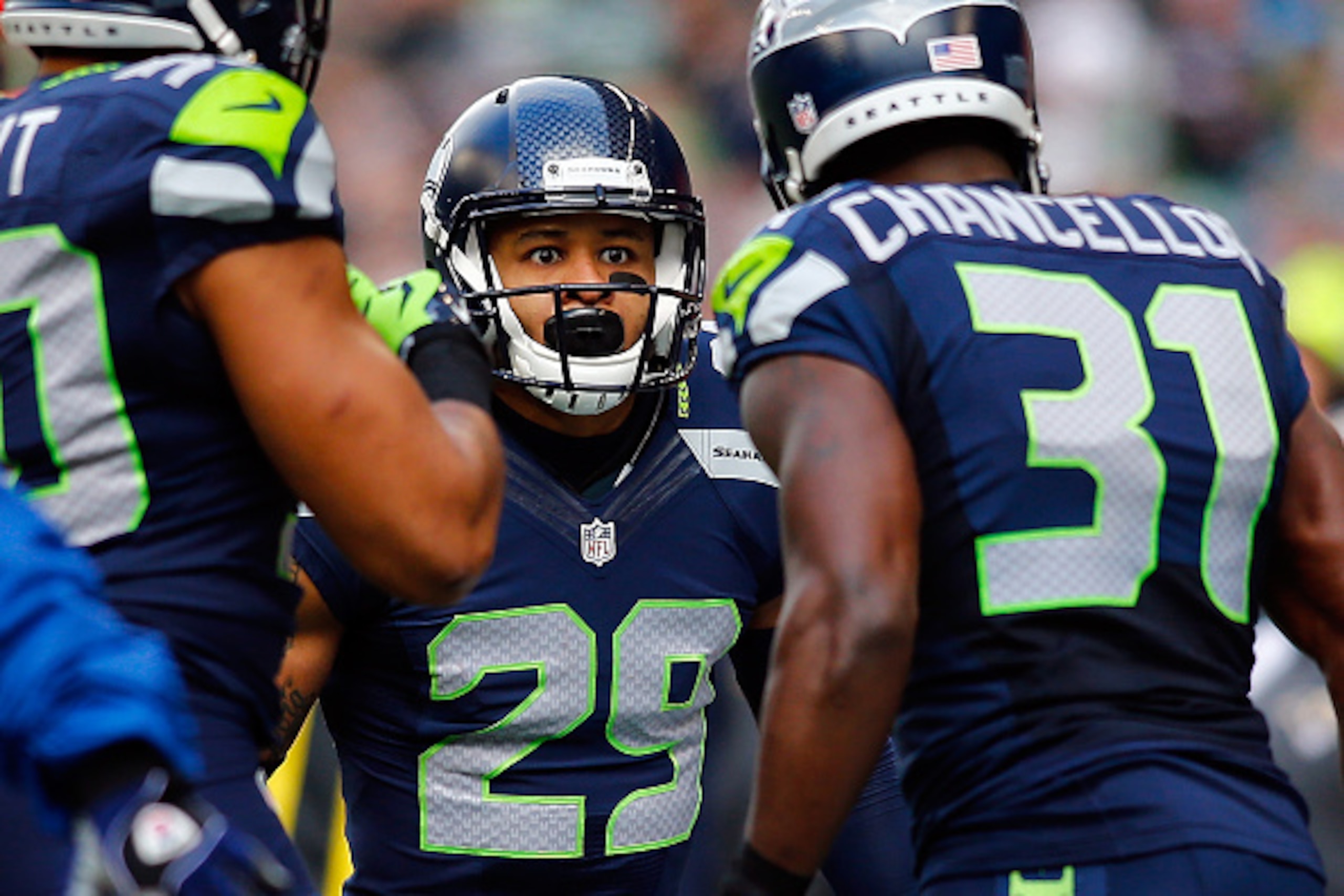 SEATTLE, WA - DECEMBER 28: Free safety Earl Thomas #29 of the Seattle Seahawks celebrates with strong safety Kam Chancellor #31 of the Seattle Seahawks after making a play during the first quarter of the game against the St. Louis Rams at CenturyLink Fiel