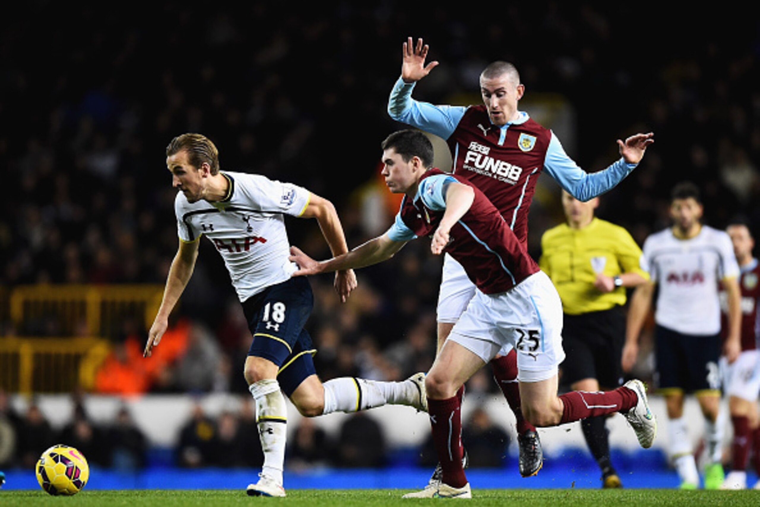 LONDON, ENGLAND - DECEMBER 20: Harry Kane of Tottenham Hotspur is closed down by Michael Keane of Burnley during the Barclays Premier League match between Tottenham Hotspur and Burnley at White Hart Lane on December 20, 2014 in London, England.  (Photo by