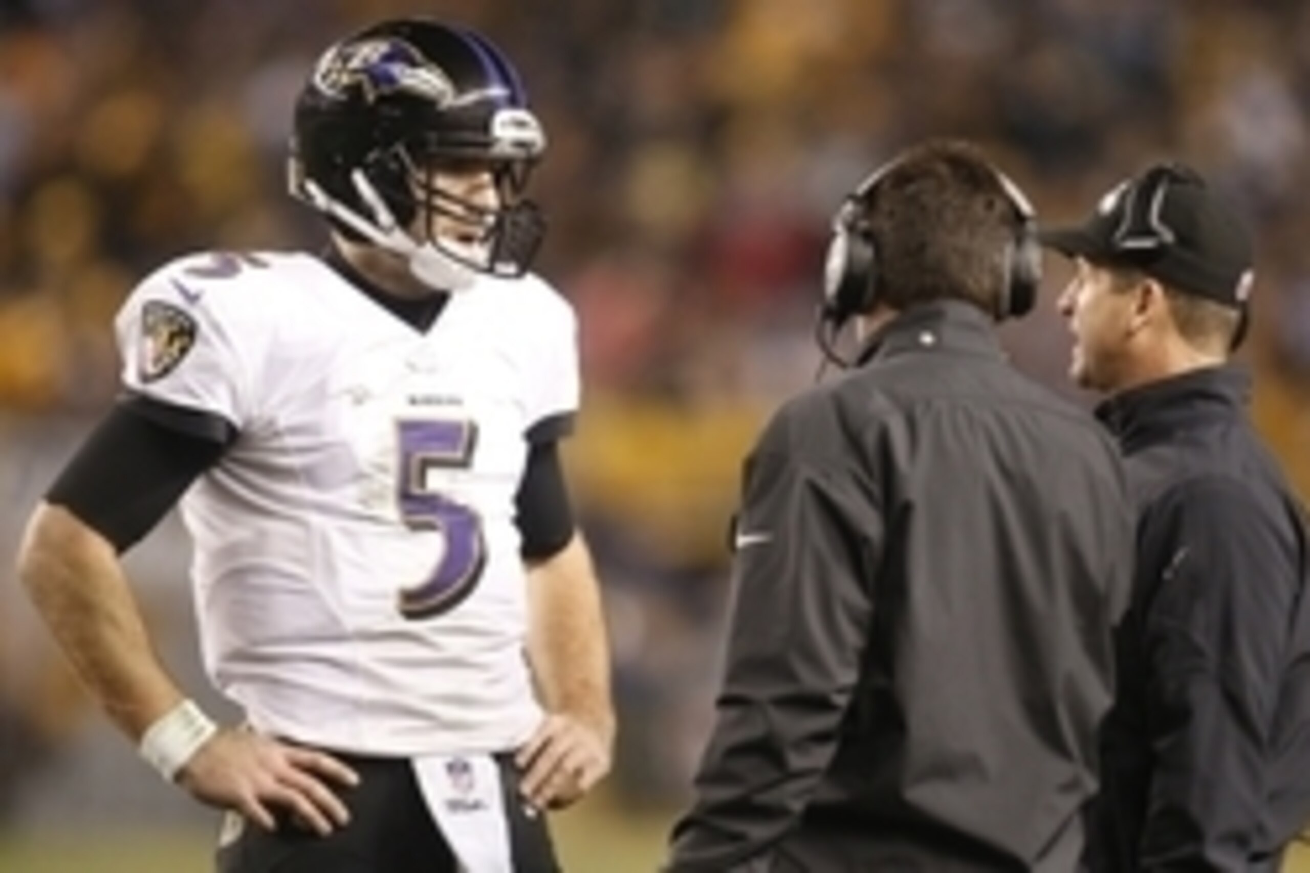 Jan 3, 2015; Pittsburgh, PA, USA; Baltimore Ravens quarterback Joe Flacco (5) talks to Baltimore Ravens head coach John Harbaugh (R) during a stoppage in play against the Pittsburgh Steelers in the second half during the 2014 AFC Wild Card playoff footbal