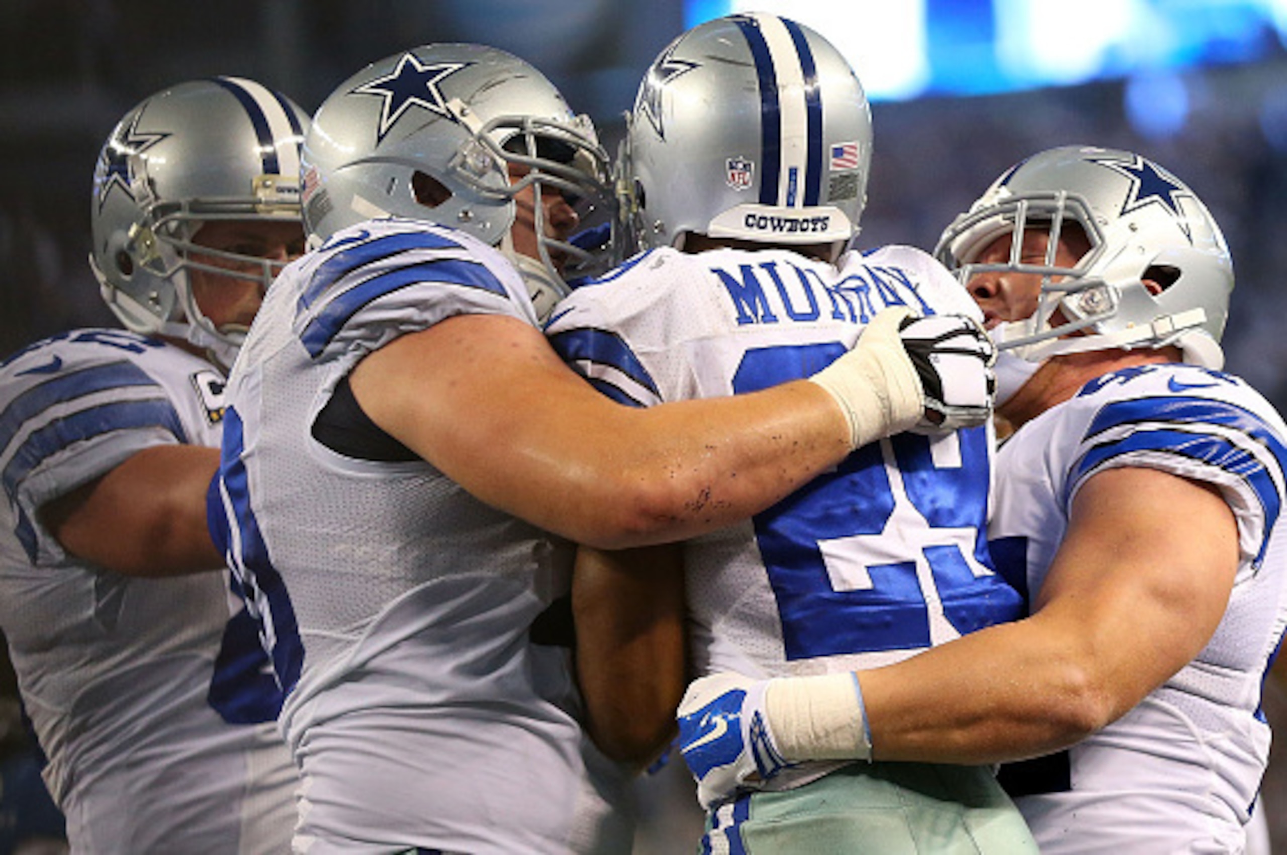 ARLINGTON, TX - JANUARY 04:  DeMarco Murray #29 of the Dallas Cowboys celebrates his touchdown against the Detroit Lions during the second half of their NFC Wild Card Playoff game at AT&T Stadium on January 4, 2015 in Arlington, Texas.  (Photo by Ronald M