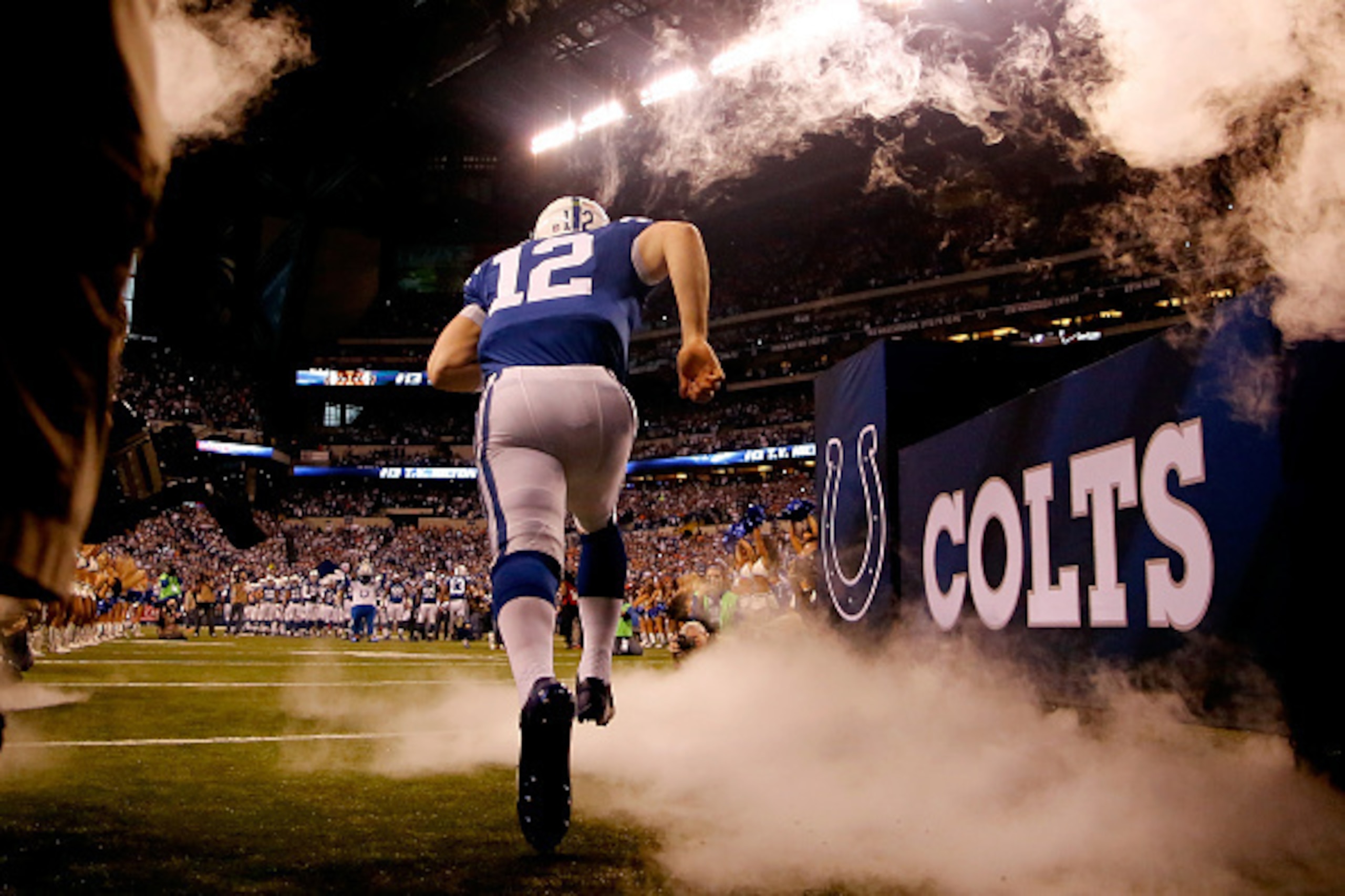 INDIANAPOLIS, IN - JANUARY 04:  Quarterback Andrew Luck #12 of the Indianapolis Colts takes the field against the Cincinnati Bengals during their AFC Wild Card game at Lucas Oil Stadium on January 4, 2015 in Indianapolis, Indiana.  (Photo by Kirk Irwin/Ge