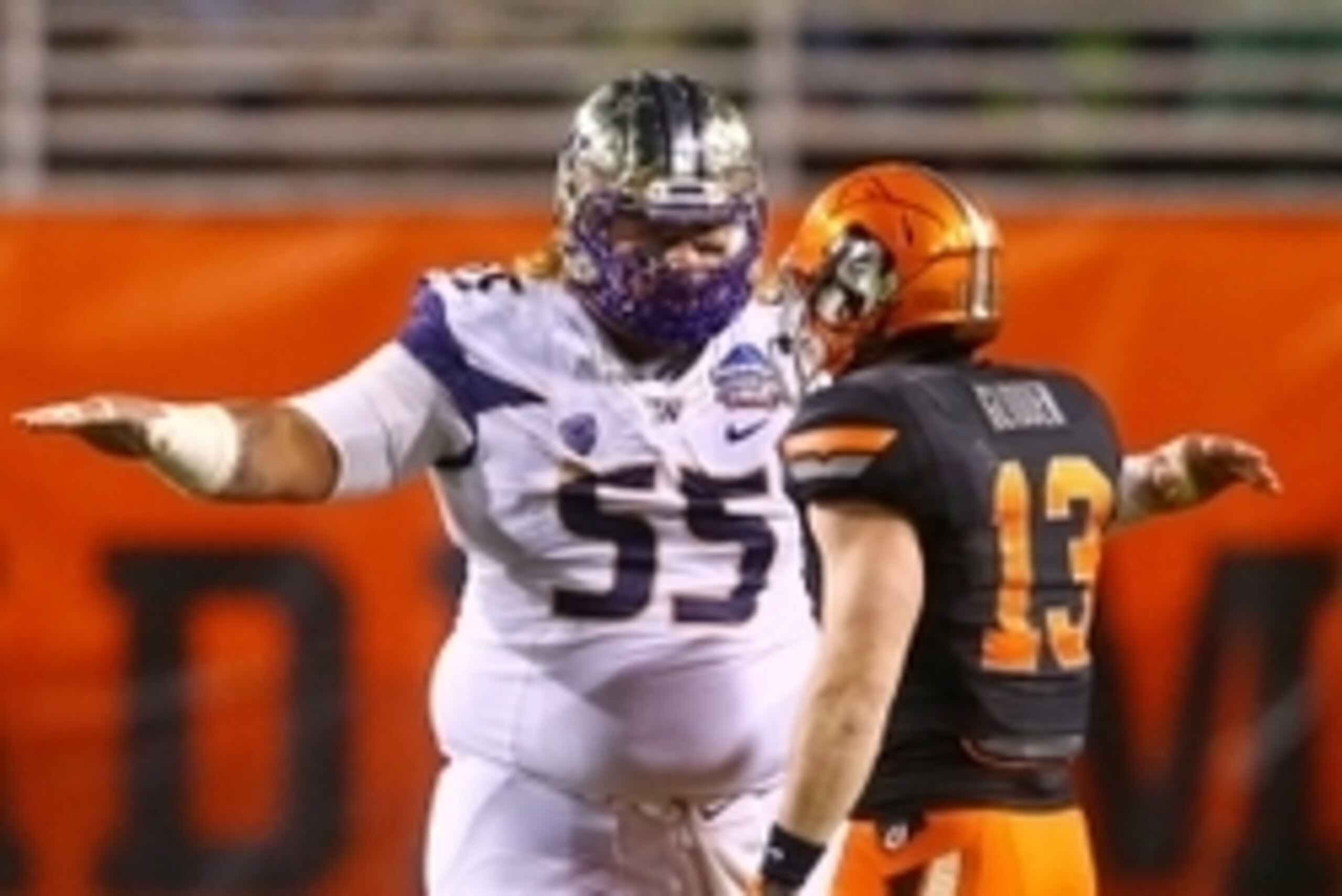 Jan 2, 2015; Tempe, AZ, USA; Washington Huskies defensive lineman Danny Shelton (55) reacts as he taunts Oklahoma State Cowboys wide receiver David Glidden (13) in the 2015 Cactus Bowl at Sun Devil Stadium. Oklahoma State defeated Washington 30-22. Mandat