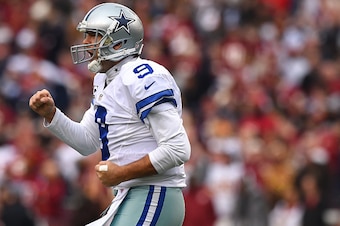 LANDOVER, MD - DECEMBER 28: Quarterback Tony Romo #9 of the Dallas Cowboys celebrates a first quarter touchdown pass to wide receiver Dez Bryant #88 of the Dallas Cowboys (not pictured) against the Washington Redskins at FedExField on December 28, 2014 in