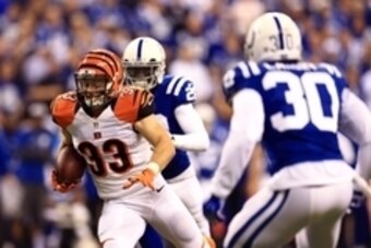 Jan 4, 2015; Indianapolis, IN, USA; Cincinnati Bengals running back Rex Burkhead (33) runs with the ball against the Indianapolis Colts in the first half in the 2014 AFC Wild Card playoff football game at Lucas Oil Stadium. Mandatory Credit: Andrew Weber-