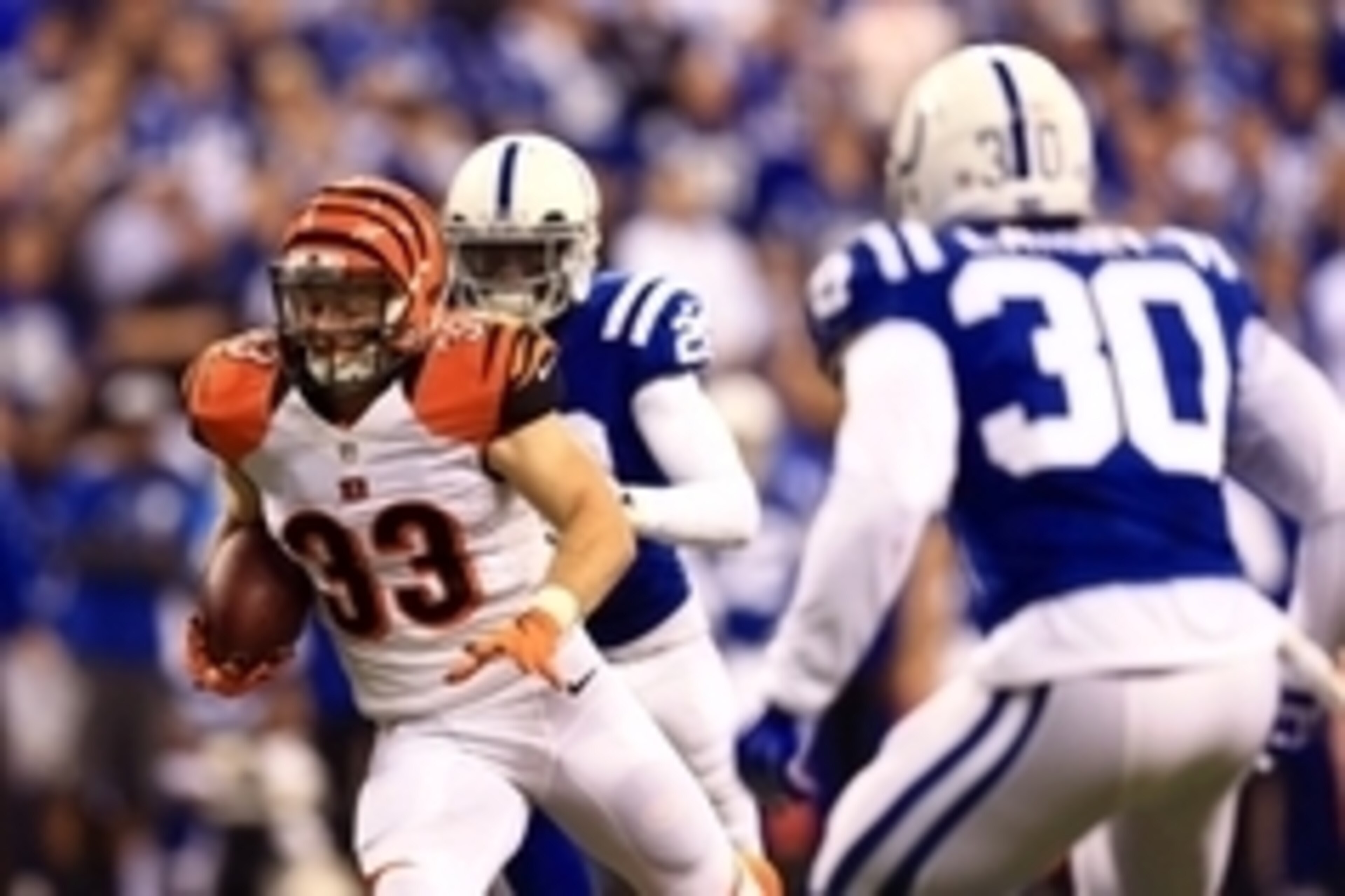 Jan 4, 2015; Indianapolis, IN, USA; Cincinnati Bengals running back Rex Burkhead (33) runs with the ball against the Indianapolis Colts in the first half in the 2014 AFC Wild Card playoff football game at Lucas Oil Stadium. Mandatory Credit: Andrew Weber-