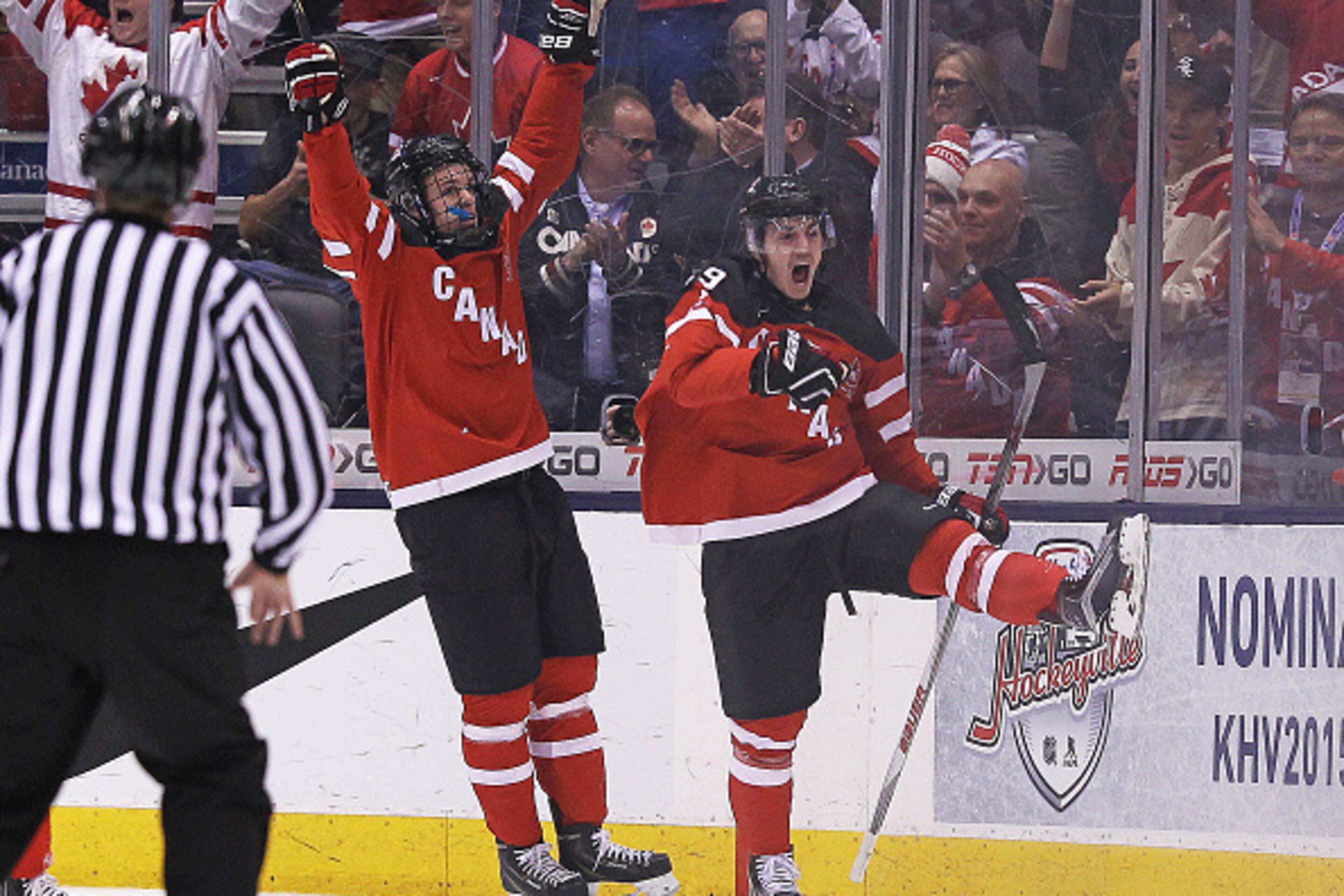 TORONTO, ON - JANUARY 4: Nic Petan #19 of Team Canada celebrates his goal with teammate Connor McDavid #17 against Team Slovakia during a semi-final game in the 2015 IIHF World Junior Hockey Championship at the Air Canada Centre on January 4, 2015 in Tor TORONTO, ON - JANUARY 4: Nic Petan #19 of Team Canada celebrates his goal with teammate Connor McDavid #17 against Team Slovakia during a semi-final game in the 2015 IIHF World Junior Hockey Championship at the Air Canada Centre on January 4, 2015 in Tor