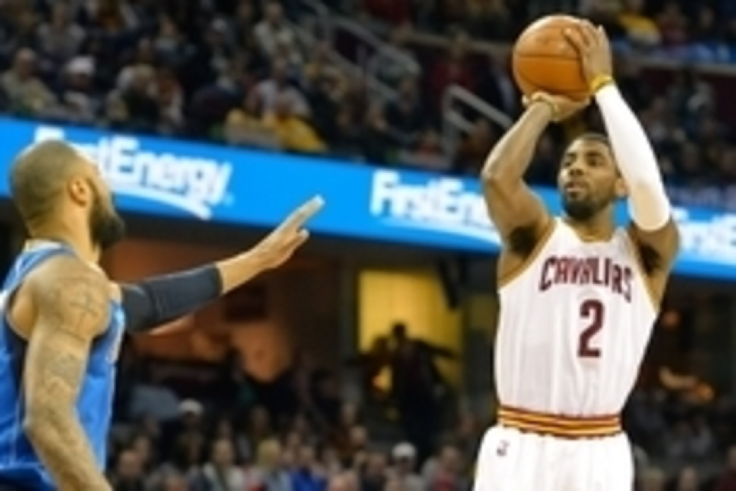 Jan 4, 2015; Cleveland, OH, USA; Cleveland Cavaliers guard Kyrie Irving (2) shoots against Dallas Mavericks center Tyson Chandler (6) in the first quarter at Quicken Loans Arena. Mandatory Credit: David Richard-USA TODAY Sports