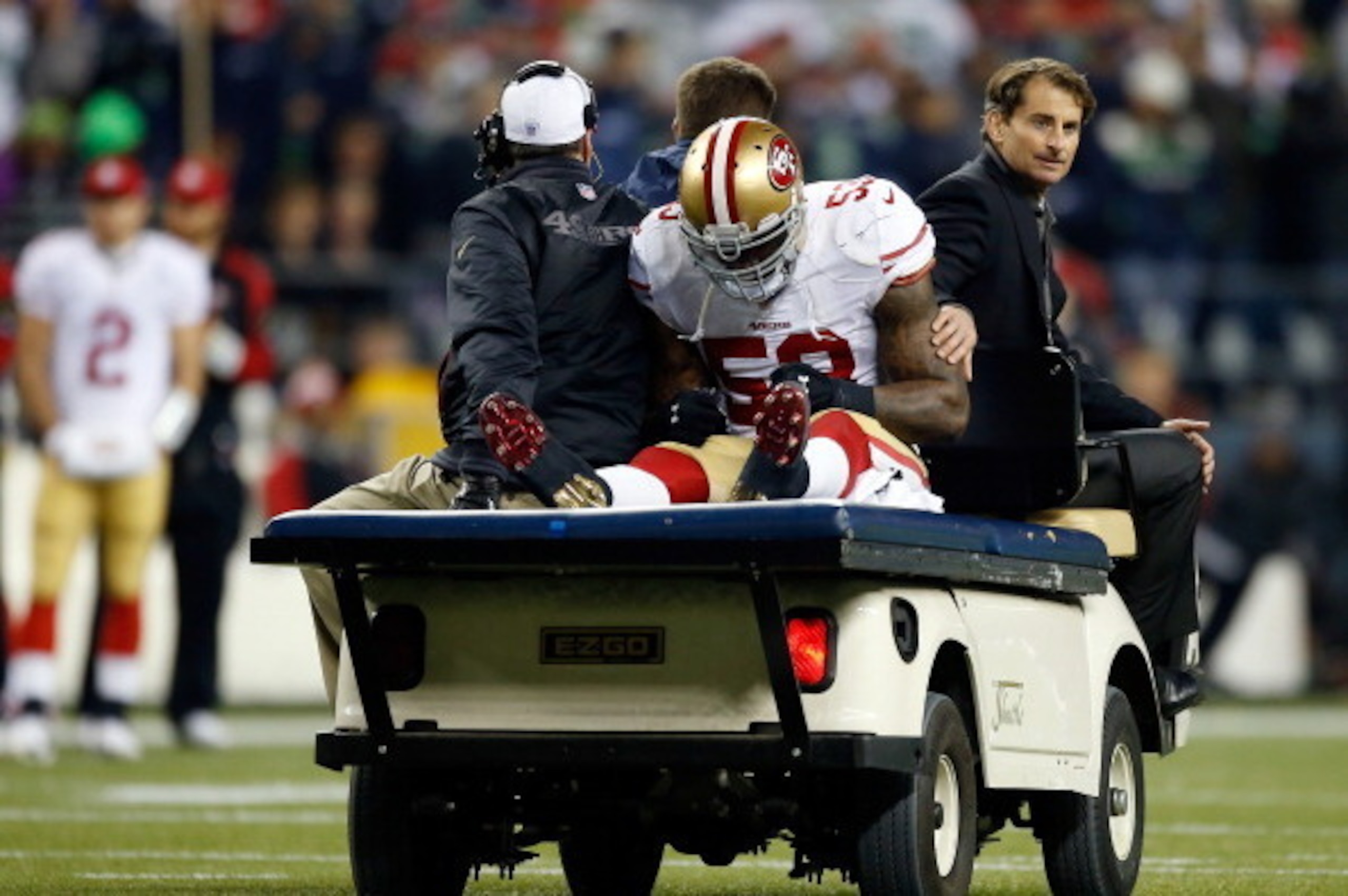 SEATTLE, WA - JANUARY 19:  Linebacker NaVorro Bowman #53 of the San Francisco 49ers is carted off the field in the fourth quarter against the Seattle Seahawks during the 2014 NFC Championship at CenturyLink Field on January 19, 2014 in Seattle, Washington