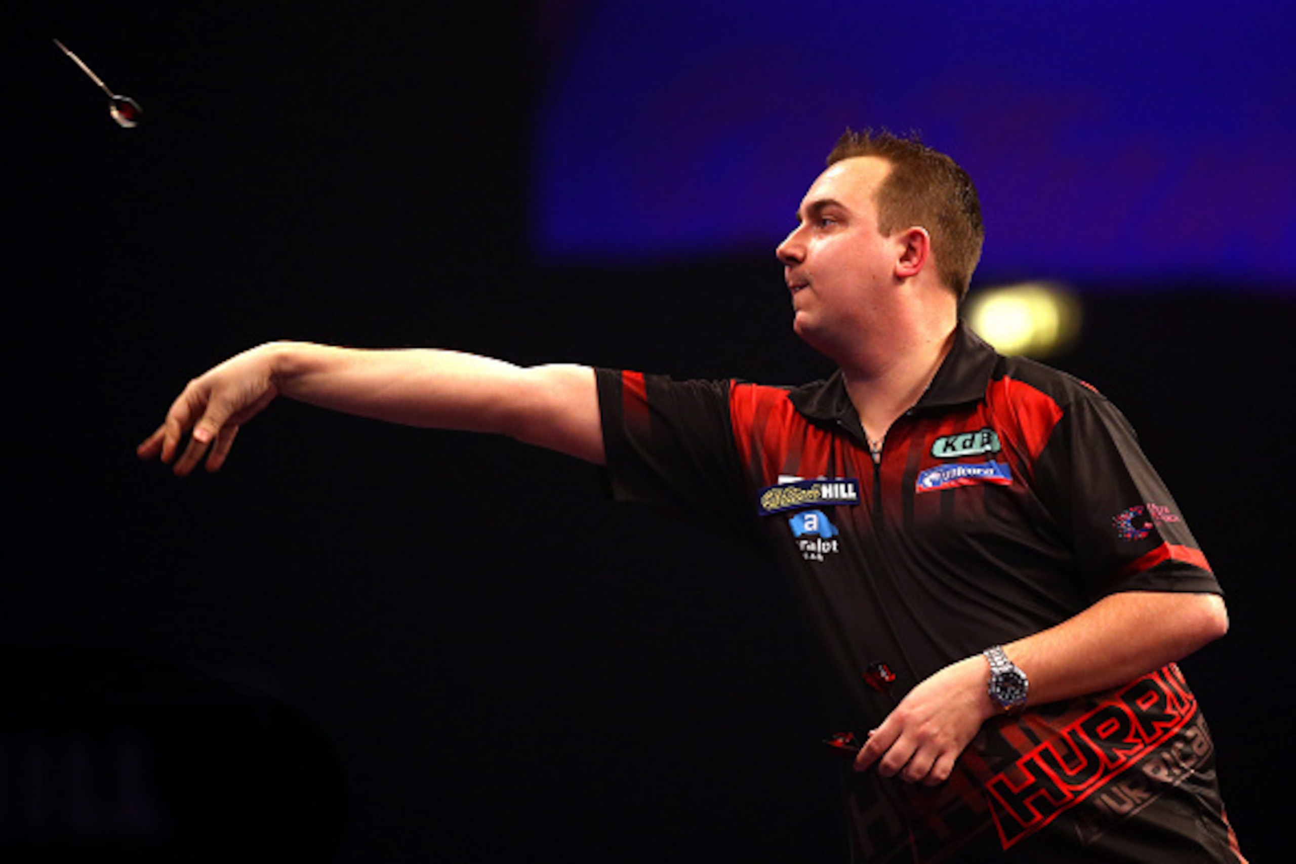 LONDON, ENGLAND - DECEMBER 30: Kim Huybrechts of Belgium in action during his third round match against Phil Taylor of England during the William Hill PDC World Darts Championships on Day Ten at Alexandra Palace on December 30, 2014 in London, England. (P
