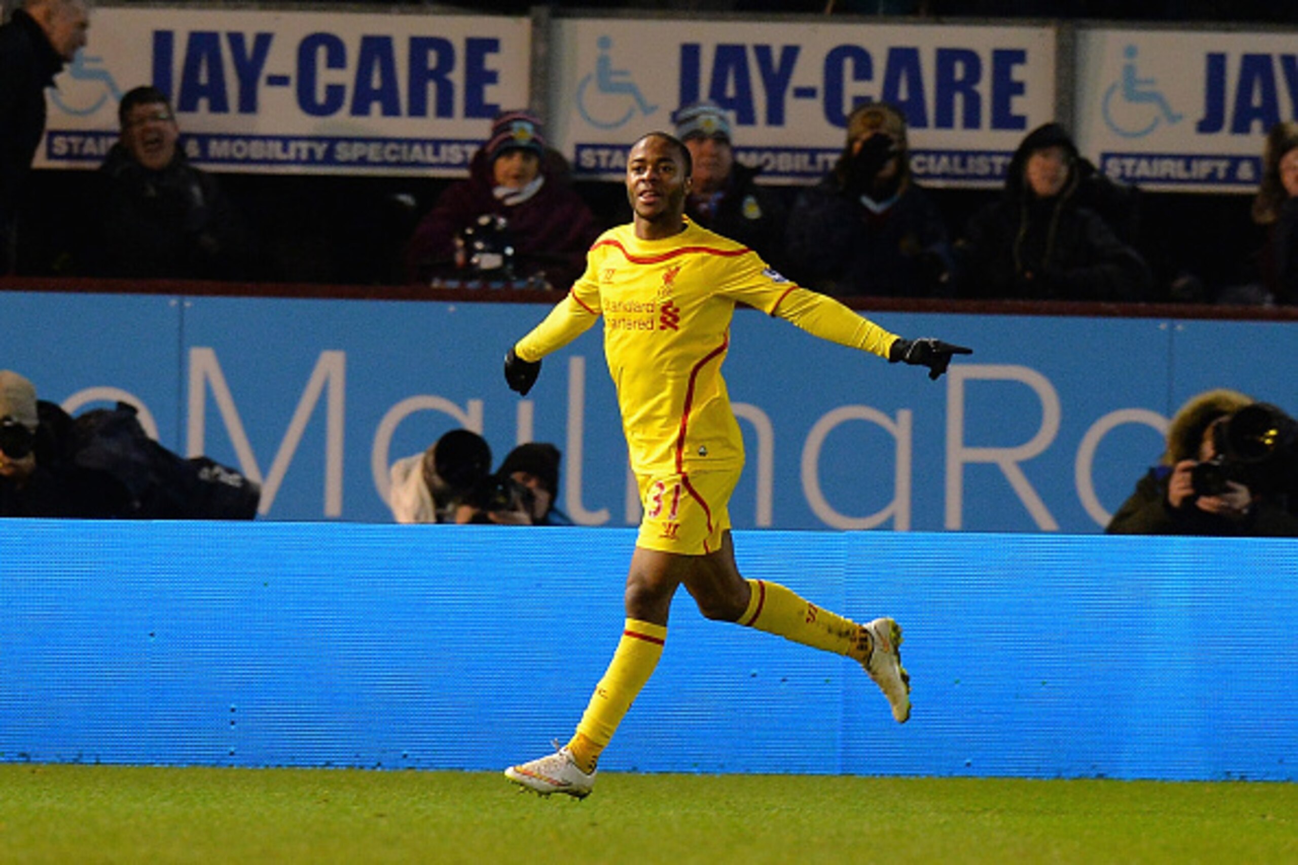 BURNLEY, ENGLAND - DECEMBER 26:  Raheem Sterling of Liverpool celebrates after scoring their first goal during the Barclays Premier League match between Burnley and Liverpool at Turf Moor on December 26, 2014 in Burnley, England.  (Photo by Tony Marshall/