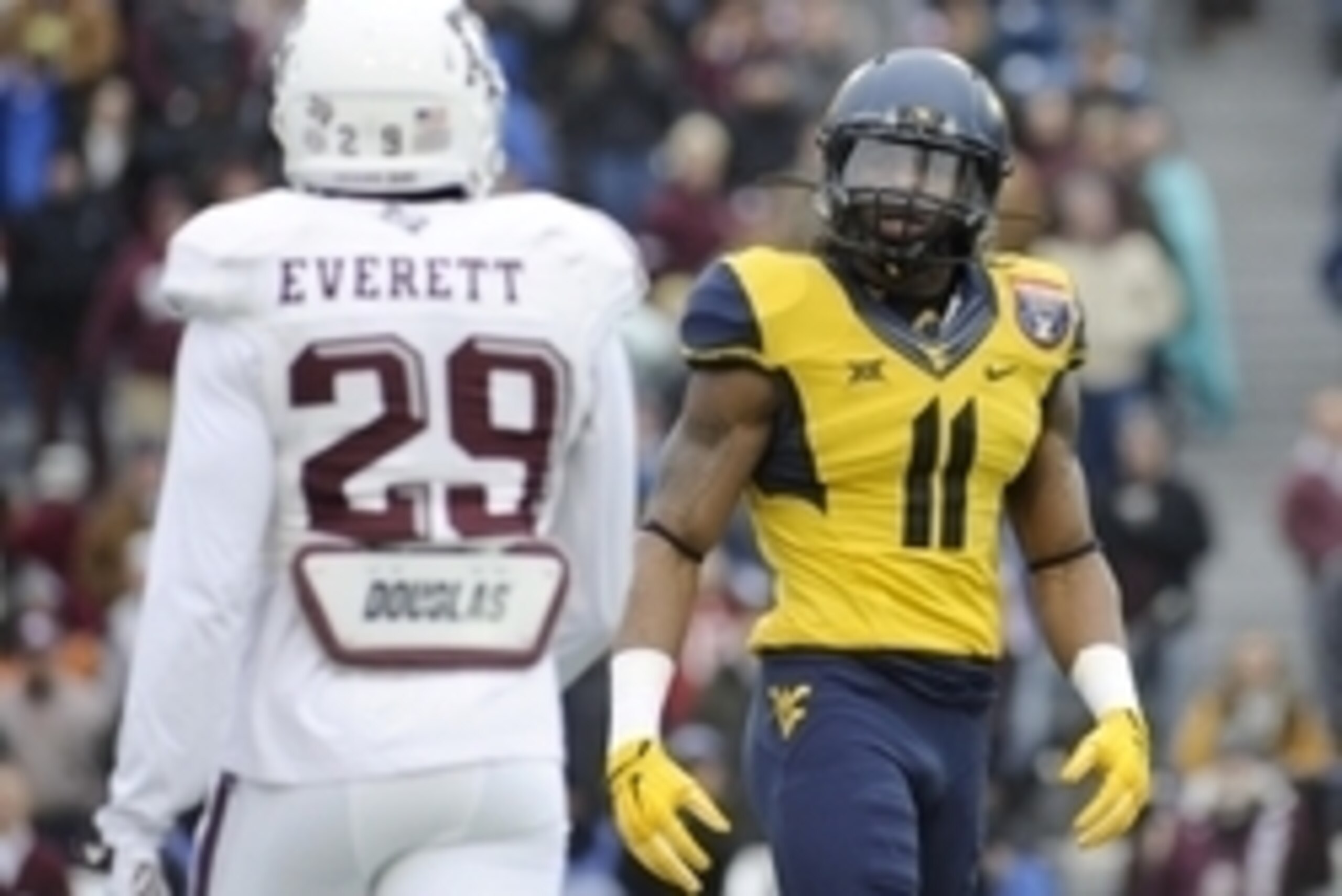 Dec 29, 2014; Memphis, TN, USA; Texas A&M Aggies defensive back Deshazor Everett (29) and West Virginia Mountaineers wide receiver Kevin White (11) during the game in the 2014 Liberty Bowl at Liberty Bowl Memorial Stadium. Mandatory Credit: Justin Ford-US