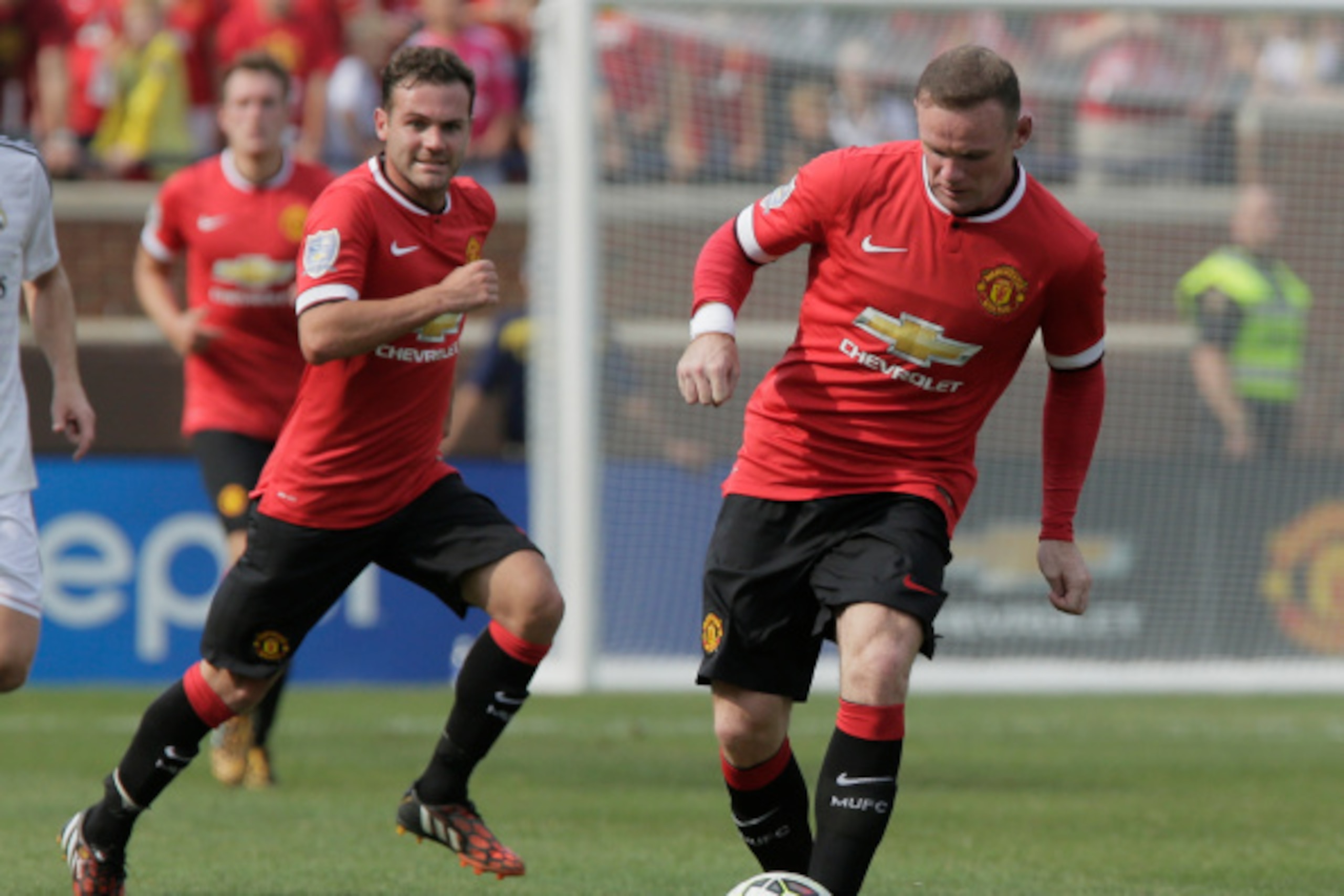 ANN ARBOR, MI - AUGUST 2: Wayne Rooney #10 of Manchester United dribbles the ball as Juan Mata #8 of Manchester United trails on the play during the second half of the Guinness International Champions Cup against Real Madrid at Michigan Stadium on August ANN ARBOR, MI - AUGUST 2: Wayne Rooney #10 of Manchester United dribbles the ball as Juan Mata #8 of Manchester United trails on the play during the second half of the Guinness International Champions Cup against Real Madrid at Michigan Stadium on August
