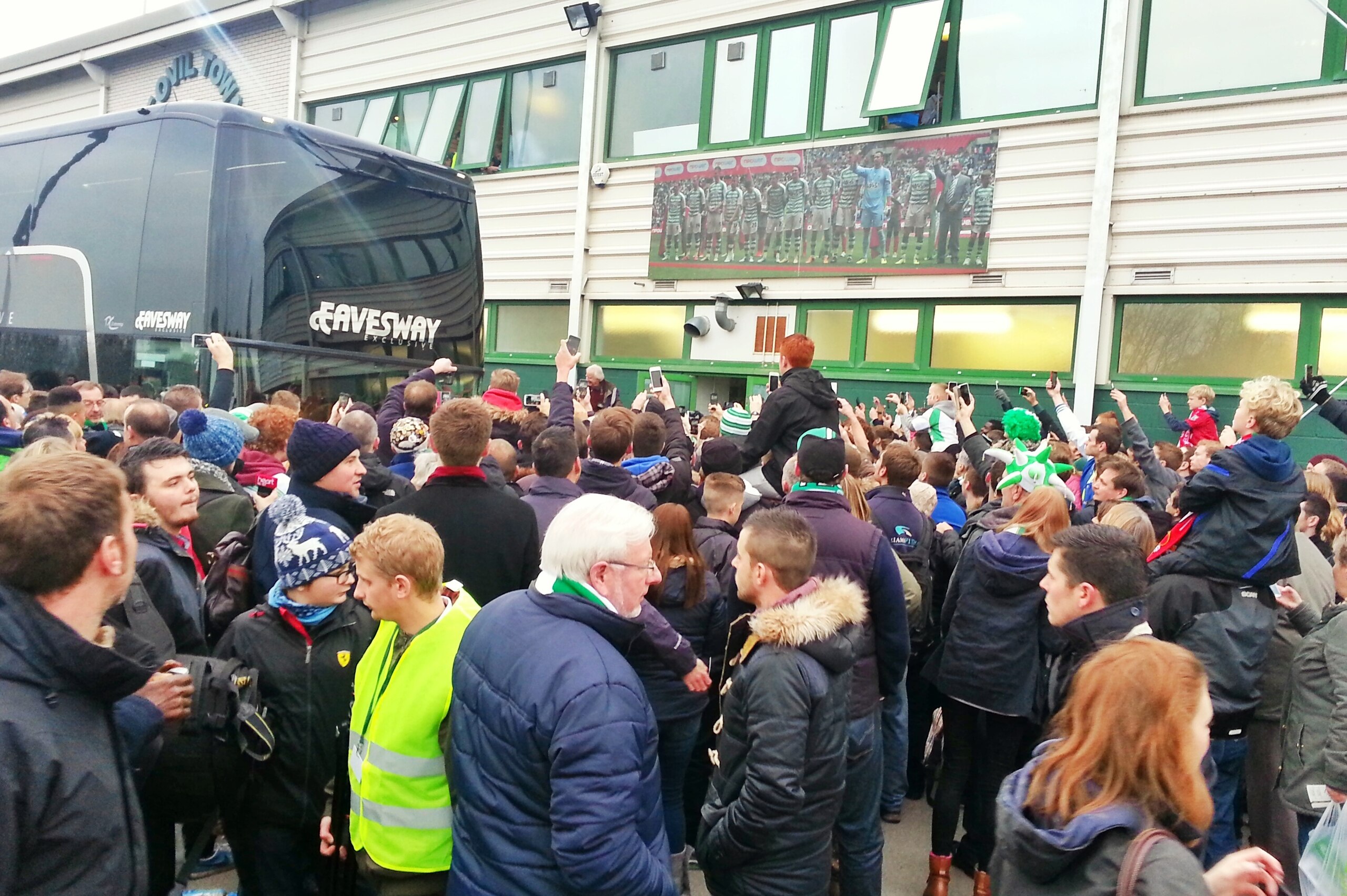 Yeovil fans crowd around as the Manchester United team bus arrives