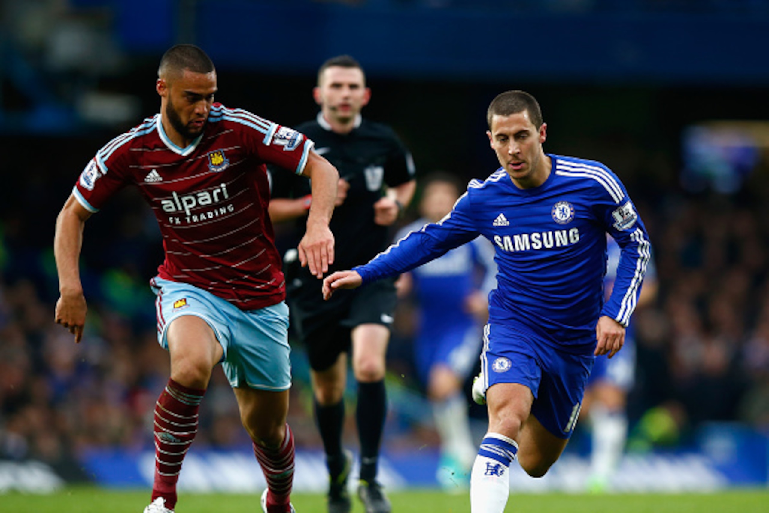 LONDON, ENGLAND - DECEMBER 26:  Winston Reid of West Ham marshalls Eden Hazard of Chelsea during the Barclays Premier League match between Chelsea and West Ham United at Stamford Bridge on December 26, 2014 in London, England.  (Photo by Clive Rose/Getty 