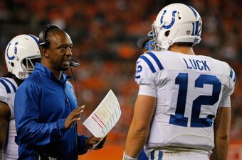 DENVER, CO - SEPTEMBER 07:  Indianapolis Colts offensive coordinator Pep Hamilton talks with quarterback Andrew Luck #12 of the Indianapolis Colts during a time out against the Denver Broncos at Sports Authority Field at Mile High on September 7, 2014 in 