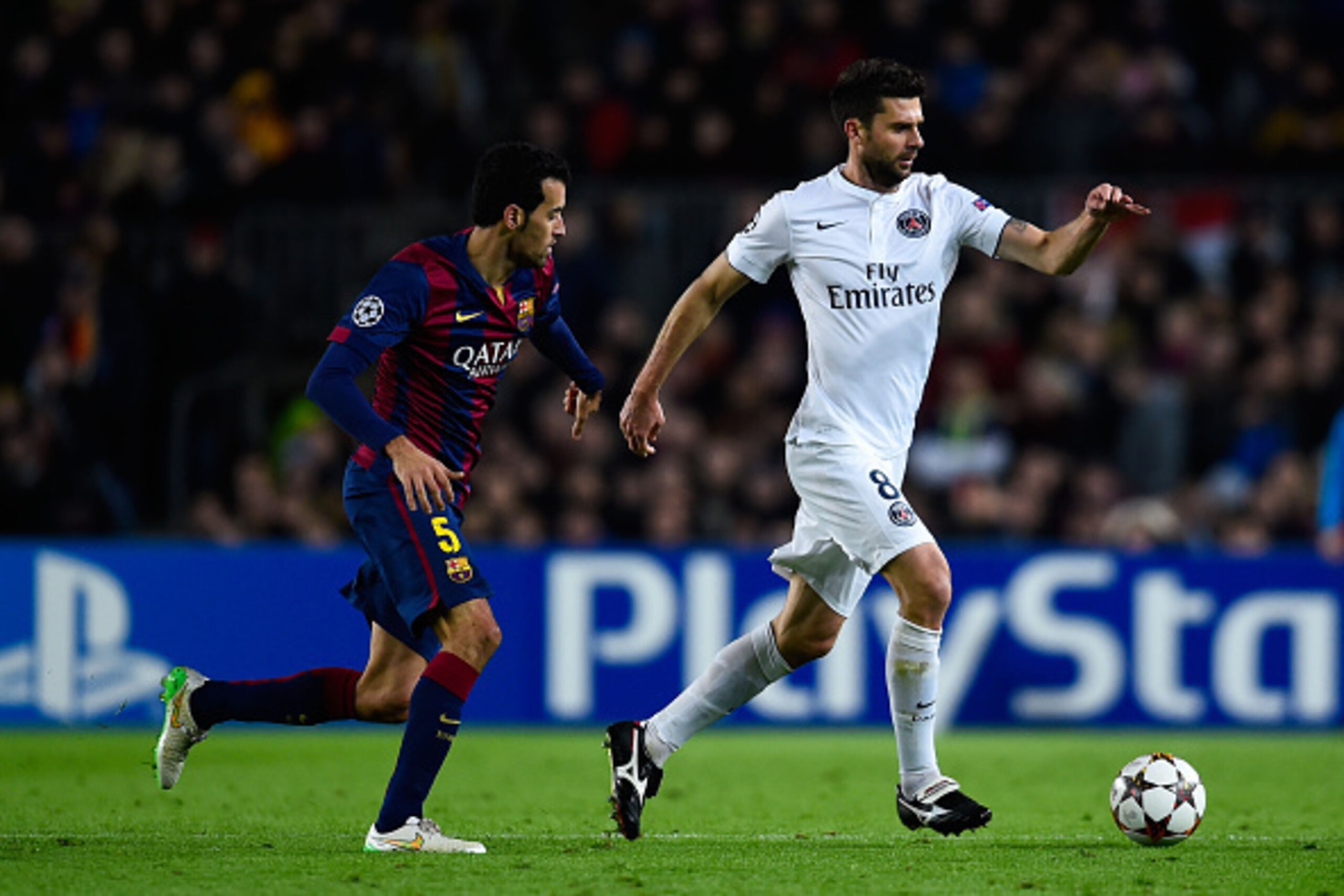 BARCELONA, SPAIN - DECEMBER 10:  Thiago Motta of Paris Saint-Germain FC competes for the ball with JSergio Busquets of FC Barcelona during prior to the UEFA Champions League group F match between FC Barcelona and Paris Saint-Germanin FC at Camp Nou Stadiu