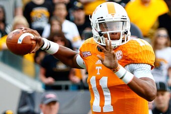 JACKSONVILLE, FL - JANUARY 02:  Joshua Dobbs #11 of the Tennessee Volunteers attempts a pass during the TaxSlayer Bowl against the Iowa Hawkeyes at EverBank Field on January 2, 2015 in Jacksonville, Florida.  (Photo by Sam Greenwood/Getty Images)