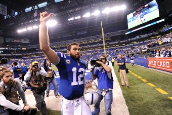 Jan 4, 2015; Indianapolis, IN, USA; Indianapolis Colts quarterback Andrew Luck (12) waves to the crowd as he leaves the field after the 2014 AFC Wild Card playoff football game against the Cincinnati Bengals at Lucas Oil Stadium. Mandatory Credit: Thomas