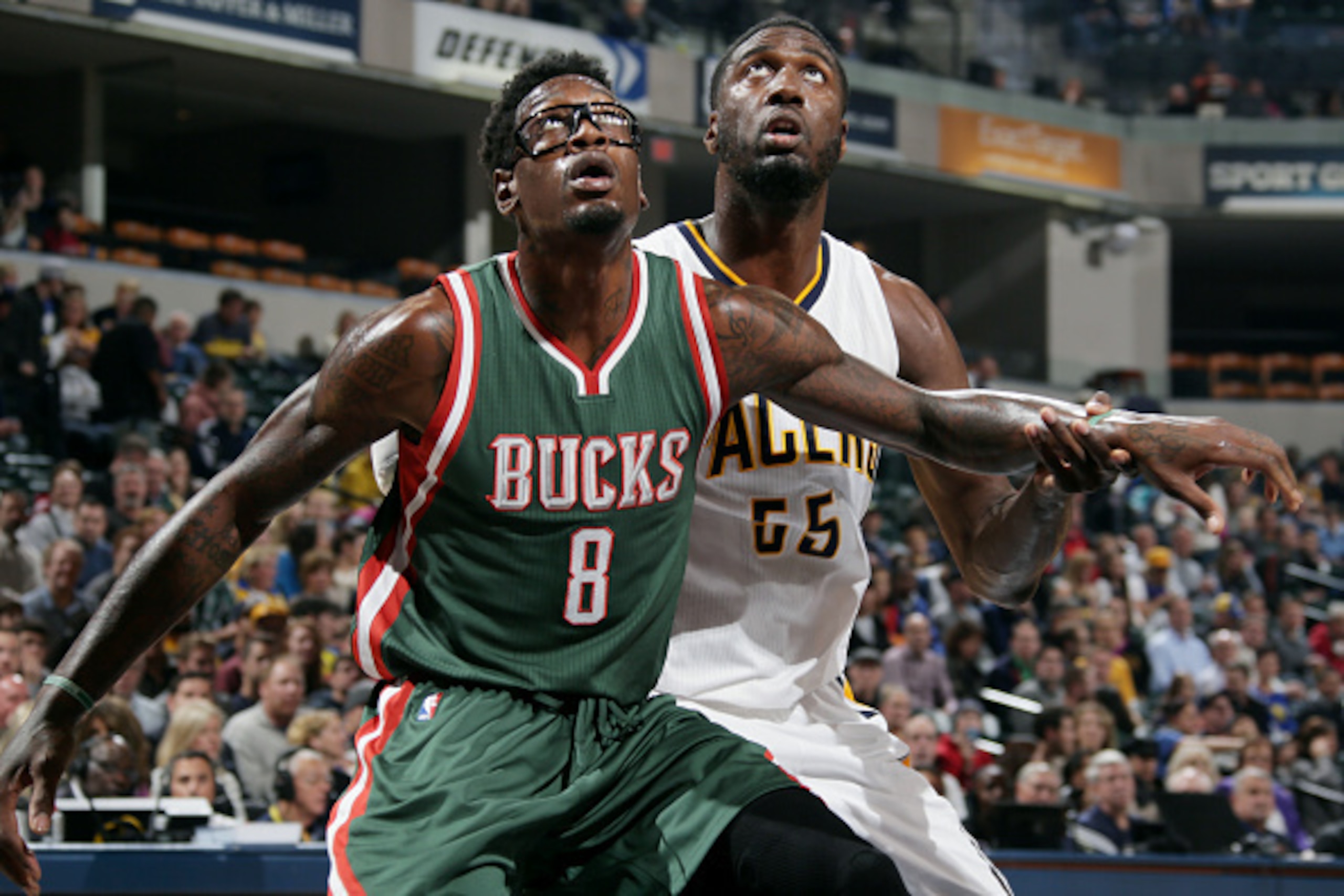 INDIANAPOLIS, IN - NOVEMBER 4: Larry Sanders #8 of the Milwaukee Bucks battles for position against Roy Hibbert #55 of the Indiana Pacers at Bankers Life Fieldhouse on November 4, 2014 in Indianapolis, Indiana. NOTE TO USER: User expressly acknowledges an