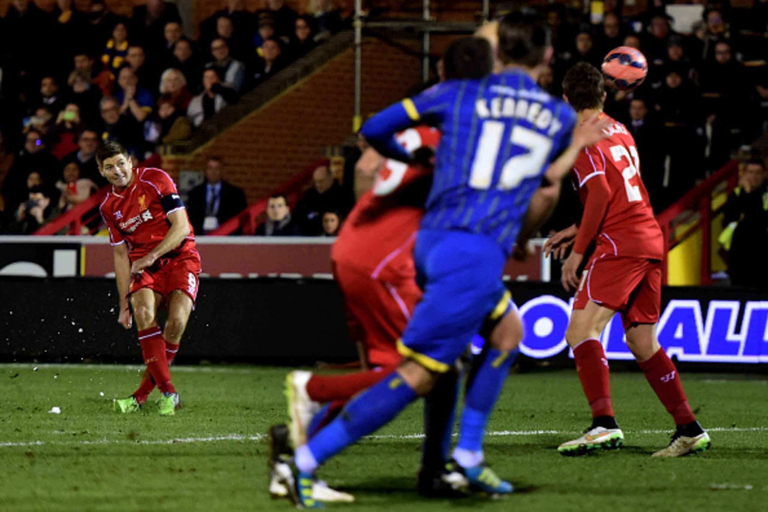 KINGSTON UPON THAMES, ENGLAND - JANUARY 05:  Steven Gerrard of Liverpool scores his team's second goal from a free kick during the FA Cup Third Round match between AFC Wimbledon and Liverpool at The Cherry Red Records Stadium on January 5, 2015 in Kingsto