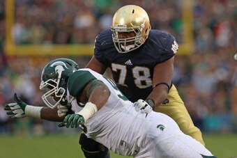 SOUTH BEND, IN - SEPTEMBER 21:  Damon Knox #93 of the Michigan State Spartans rushes against Ronnie Stanley #78 of the Notre Dame Fighting Irish at Notre Dame Stadium on September 21, 2013 in South Bend, Indiana. Notre Dame defeated Michigan State 17-13. 