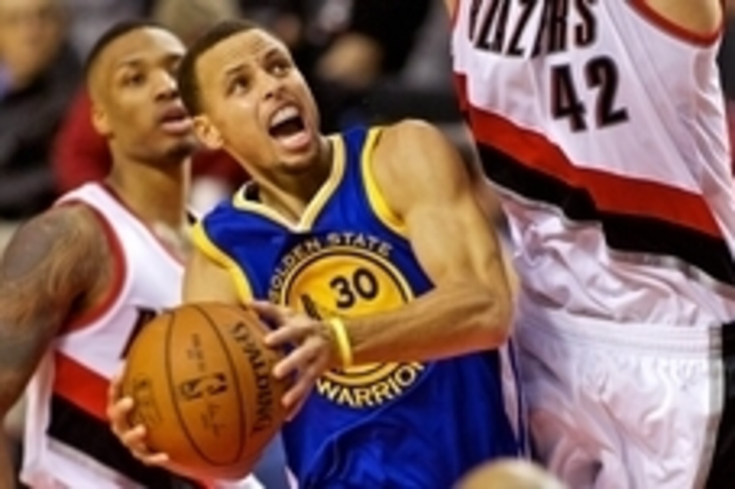 Nov 2, 2014; Portland, OR, USA; Golden State Warriors guard Stephen Curry (30) shoots past Portland Trail Blazers center Robin Lopez (42) during the third quarter at the Moda Center. Mandatory Credit: Craig Mitchelldyer-USA TODAY Sports