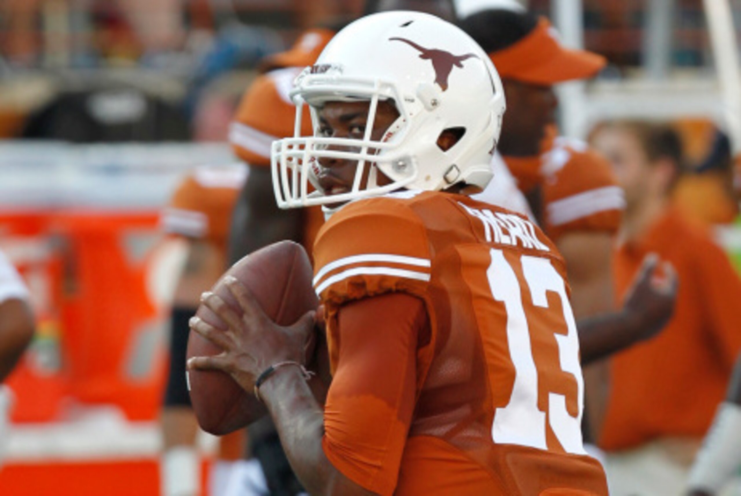 AUSTIN, TX - SEPTEMBER 6: Jerrod Heard #13 of the Texas Longhorns passes during pre game warmups before playing the BYU Cougars on September 6, 2014 at Darrell K Royal-Texas Memorial Stadium in Austin, Texas. (Photo by Chris Covatta/Getty Images)
