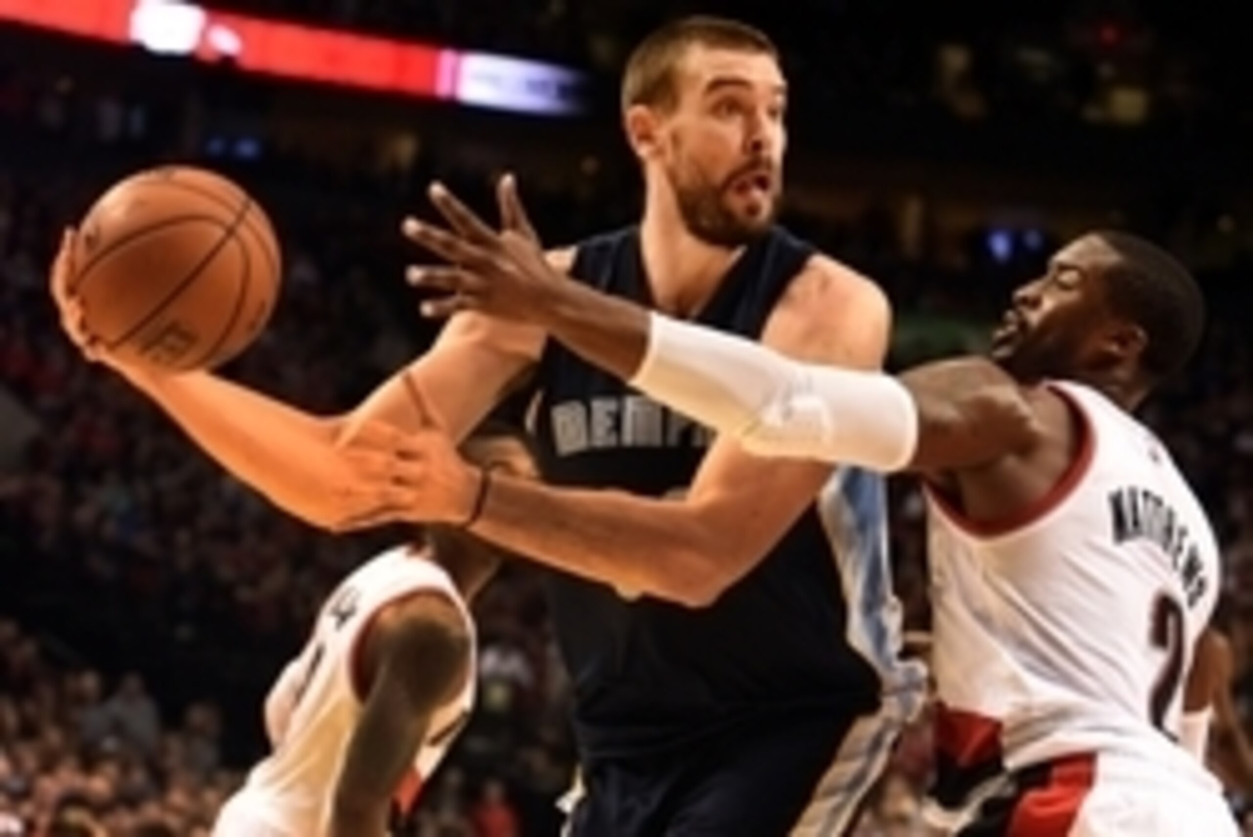 Nov 28, 2014; Portland, OR, USA; Memphis Grizzlies center Marc Gasol (33) looks to pass the ball on Portland Trail Blazers guard Wesley Matthews (2) during the fourth quarter of the game at the Moda Center at the Rose Quarter. Mandatory Credit: Steve Dyke