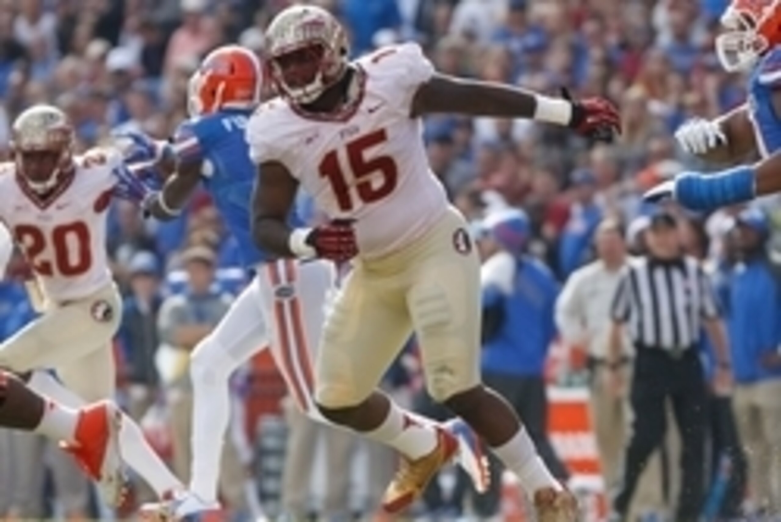 Nov 30, 2013; Gainesville, FL, USA; Florida State Seminoles defensive end Mario Edwards Jr. (15) rushes against the Florida Gators during the second half at Ben Hill Griffin Stadium. Florida State Seminoles defeated the Florida Gators 37-7. Mandatory Cred