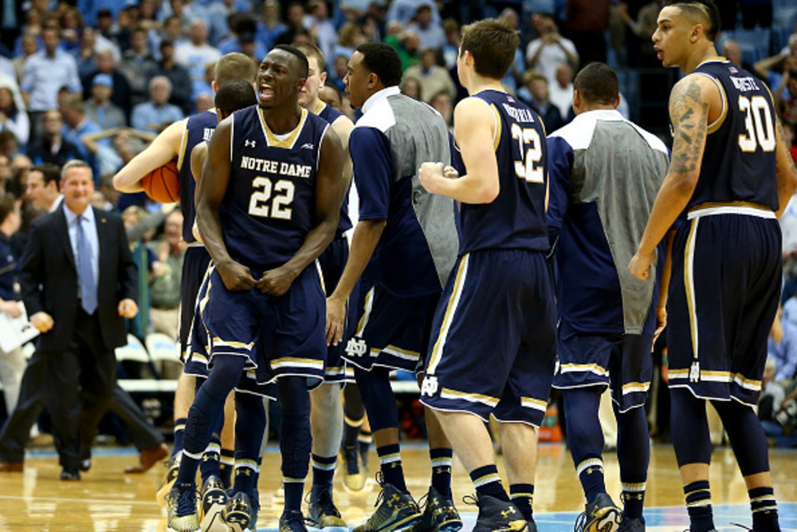 CHAPEL HILL, NC - JANUARY 05:  Jerian Grant #22 of the Notre Dame Fighting Irish and his teammates celebrate after defeating the North Carolina Tar Heels 71-70 after their game at Dean Smith Center on January 5, 2015 in Chapel Hill, North Carolina.  (Phot