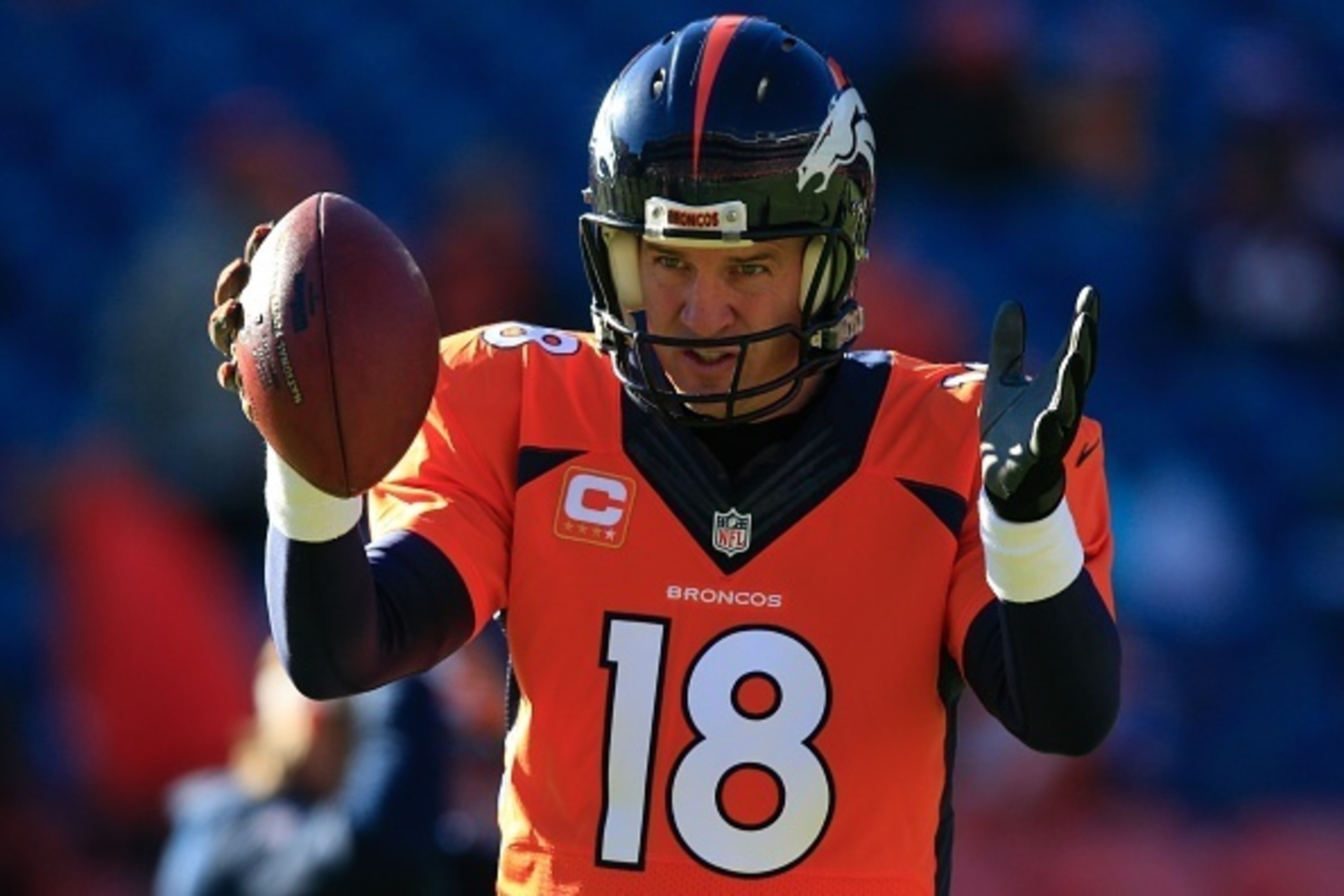 DENVER, CO - DECEMBER 28:  Quarterback Peyton Manning #18 of the Denver Broncos warms up before a game against the Oakland Raiders at Sports Authority Field at Mile High on December 28, 2014 in Denver, Colorado.  (Photo by Doug Pensinger/Getty Images)