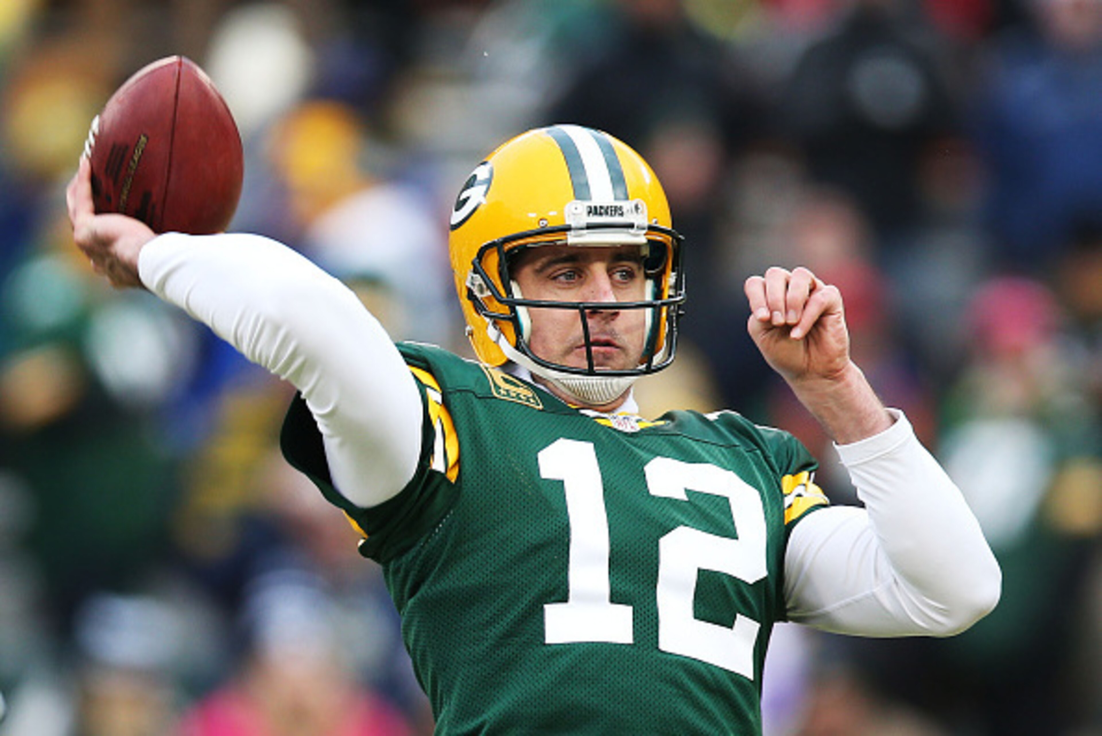 GREEN BAY, WI - DECEMBER 28:  Aaron Rodgers #12 of the Green Bay Packers warms up prior to their game against the Detroit Lions at Lambeau Field on December 28, 2014 in Green Bay, Wisconsin.  (Photo by Chris Graythen/Getty Images)
