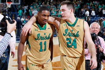 SOUTH BEND, IN - DECEMBER 3: Pat Connaughton #24 and Demetrius Jackson #11 of the Notre Dame Fighting Irish celebrate after the game against the Michigan State Spartans in the ACC/Big Ten Challenge game at Purcell Pavilion on December 3, 2014 in South Ben