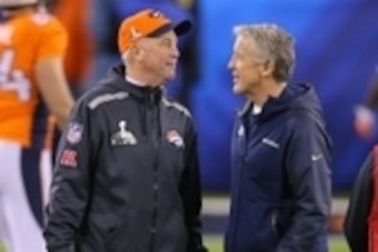Feb 2, 2014; East Rutherford, NJ, USA; Denver Broncos head coach John Fox and Seattle Seahawks head coach Pete Carroll talk before Super Bowl XLVIII at MetLife Stadium.  Mandatory Credit: Adam Hunger-USA TODAY Sports
