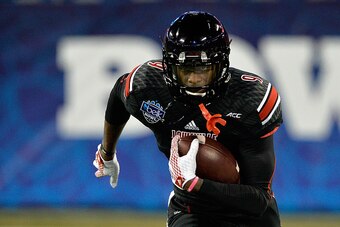 CHARLOTTE, NC - DECEMBER 30:  DeVante Parker #9 of the Louisville Cardinals warms up before the Belk Bowl against the Georgia Bulldogs at Bank of America Stadium on December 30, 2014 in Charlotte, North Carolina.  (Photo by Grant Halverson/Getty Images)
