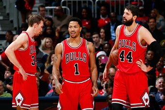 ATLANTA, GA - DECEMBER 15:  Mike Dunleavy #34, Derrick Rose #1 and Nikola Mirotic #44 of the Chicago Bulls react after a foul during the game against the Atlanta Hawks at Philips Arena on December 15, 2014 in Atlanta, Georgia.  NOTE TO USER: User expressl