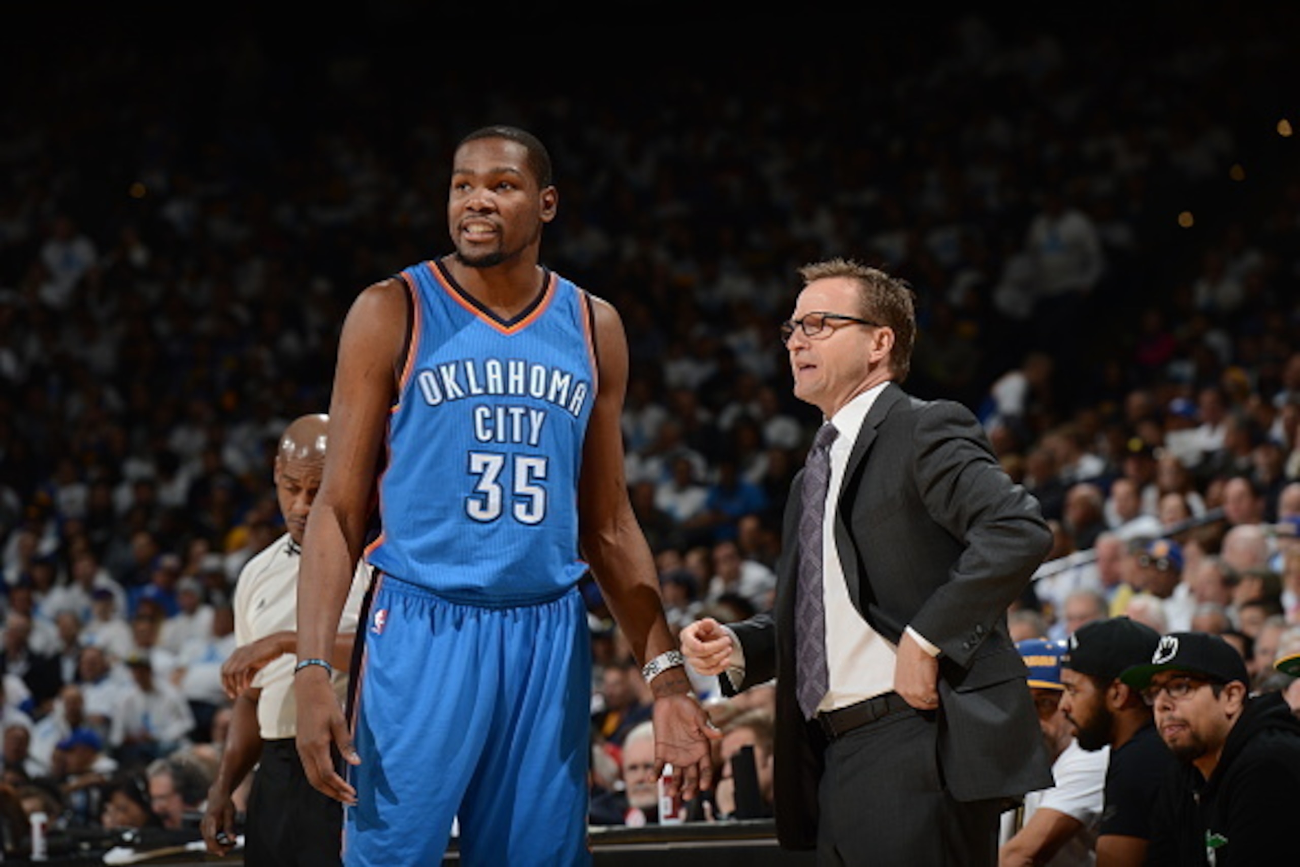 OAKLAND, CA - JANUARY 5: Kevin Durant #35 and Head coach Scott Brooks of the Oklahoma City Thunder talk during the game against the Golden State Warriors on January 5, 2015 at Oracle Arena in Oakland, California. NOTE TO USER: User expressly acknowledges OAKLAND, CA - JANUARY 5: Kevin Durant #35 and Head coach Scott Brooks of the Oklahoma City Thunder talk during the game against the Golden State Warriors on January 5, 2015 at Oracle Arena in Oakland, California. NOTE TO USER: User expressly acknowledges