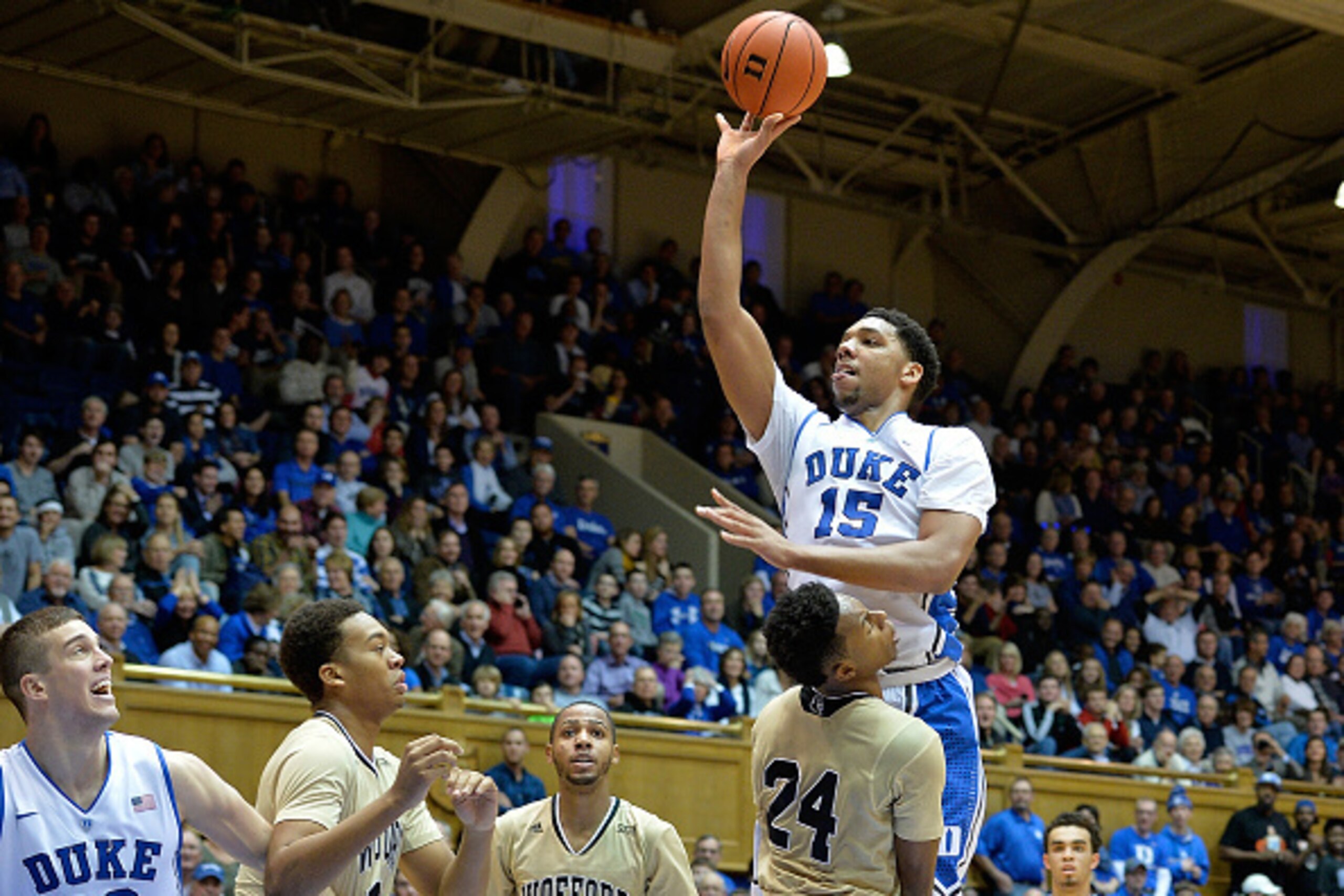 DURHAM, NC - DECEMBER 31: Jahlil Okafor #15 of the Duke Blue Devils shoots over Justin Gordon #24 of the Wofford Terriers during their game at Cameron Indoor Stadium on December 31, 2014 in Durham, North Carolina. (Photo by Grant Halverson/Getty Images)