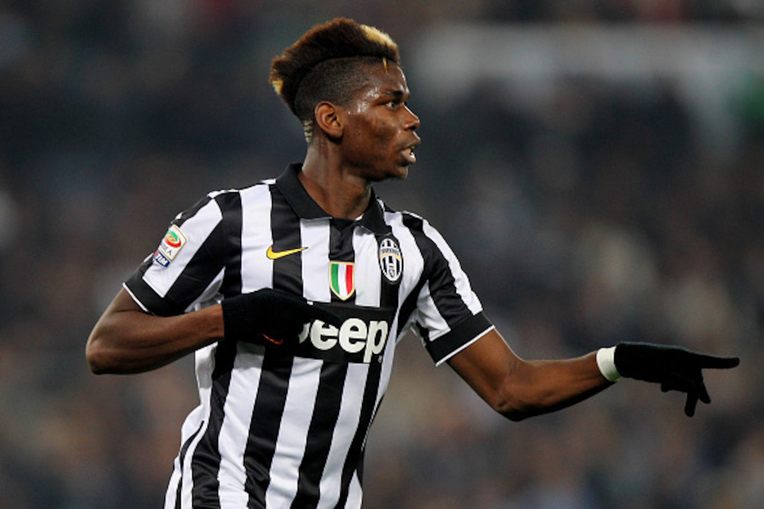 ROME, ITALY - NOVEMBER 22:  Paul Pogba of Juventus FC celebrates after scoring the opening goal during the Serie A match between SS Lazio and Juventus FC at Stadio Olimpico on November 22, 2014 in Rome, Italy.  (Photo by Paolo Bruno/Getty Images)