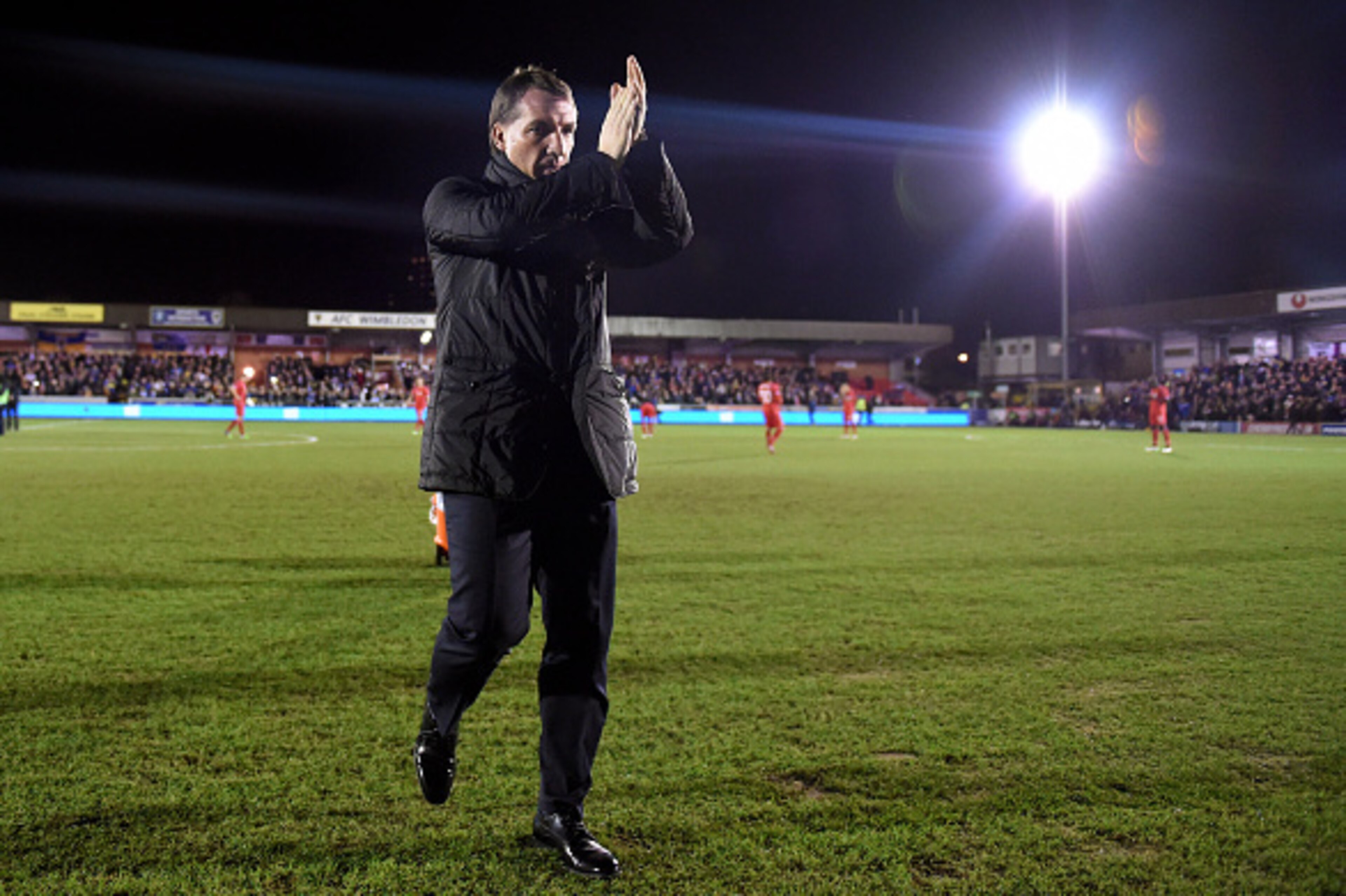 KINGSTON UPON THAMES, ENGLAND - JANUARY 05:  Brendan Rodgers the manager of Liverpool acknowledges the fans prior to kickoff during the FA Cup Third Round match between AFC Wimbledon and Liverpool at The Cherry Red Records Stadium on January 5, 2015 in Ki