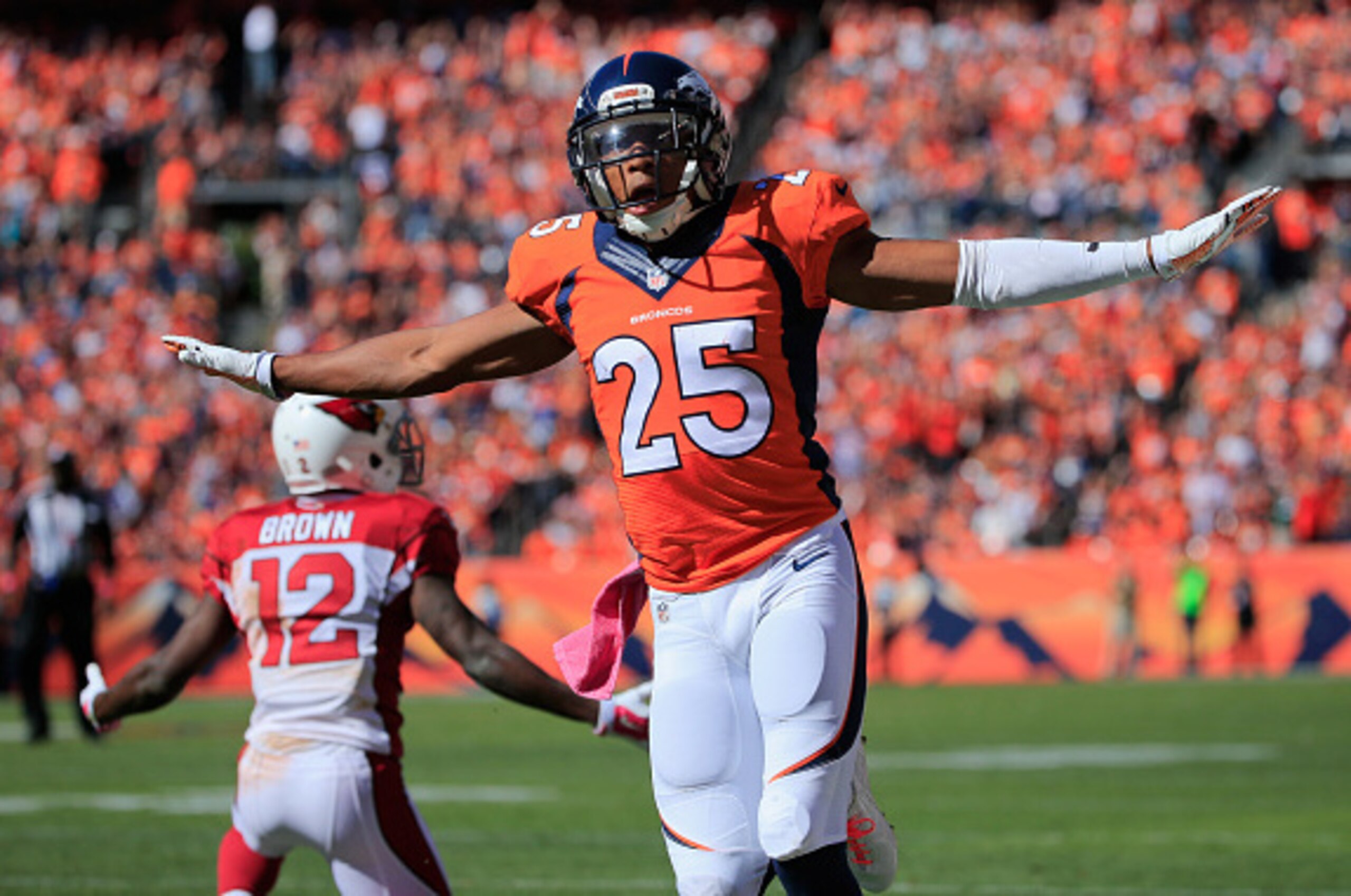 DENVER, CO - OCTOBER 05:  Cornerback Chris Harris #25 of the Denver Broncos celebrates after breaking up a pass intended for wide receiver John Brown #12 of the Arizona Cardinals at Sports Authority Field at Mile High on October 5, 2014 in Denver, Colorad
