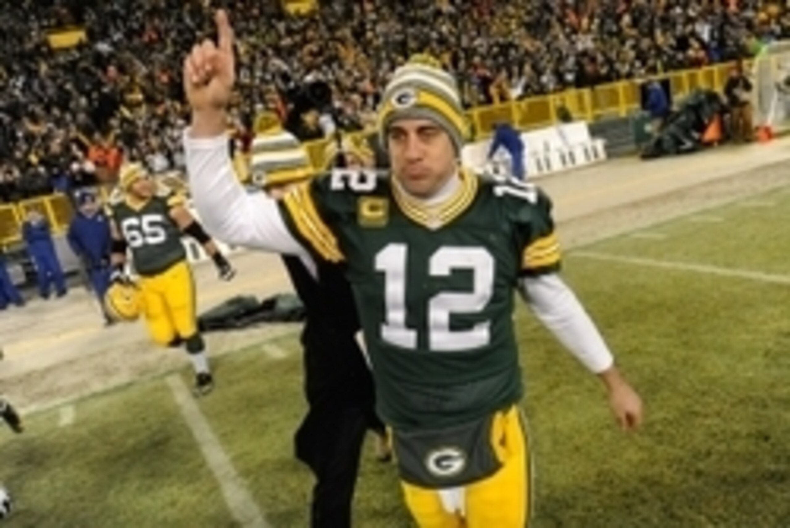 Dec 28, 2014; Green Bay, WI, USA;  Green Bay Packers quarterback Aaron Rodgers (12) reacts after the Packers beat the Detroit Lions 30-20 at Lambeau Field. Mandatory Credit: Benny Sieu-USA TODAY Sports